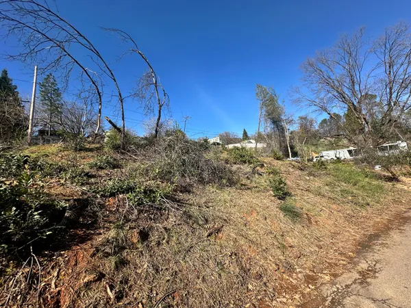 a view of a backyard of the house