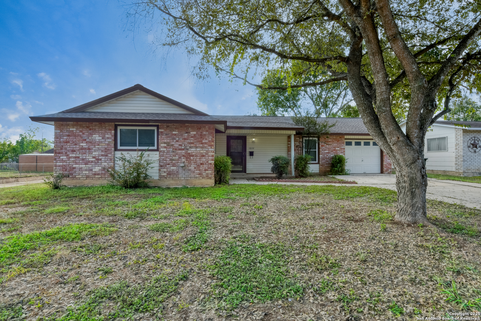 1044 Richmond Drive Schertz, TX 78154 - Photo 1 of 23 a front view of a house with garden