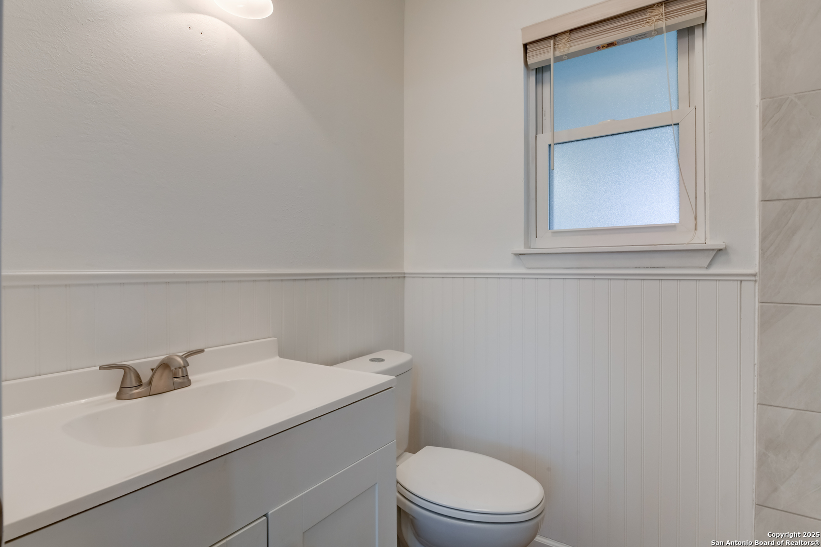 1044 Richmond Drive Schertz, TX 78154 - Photo 12 of 23 a bathroom with a sink a toilet and vanity