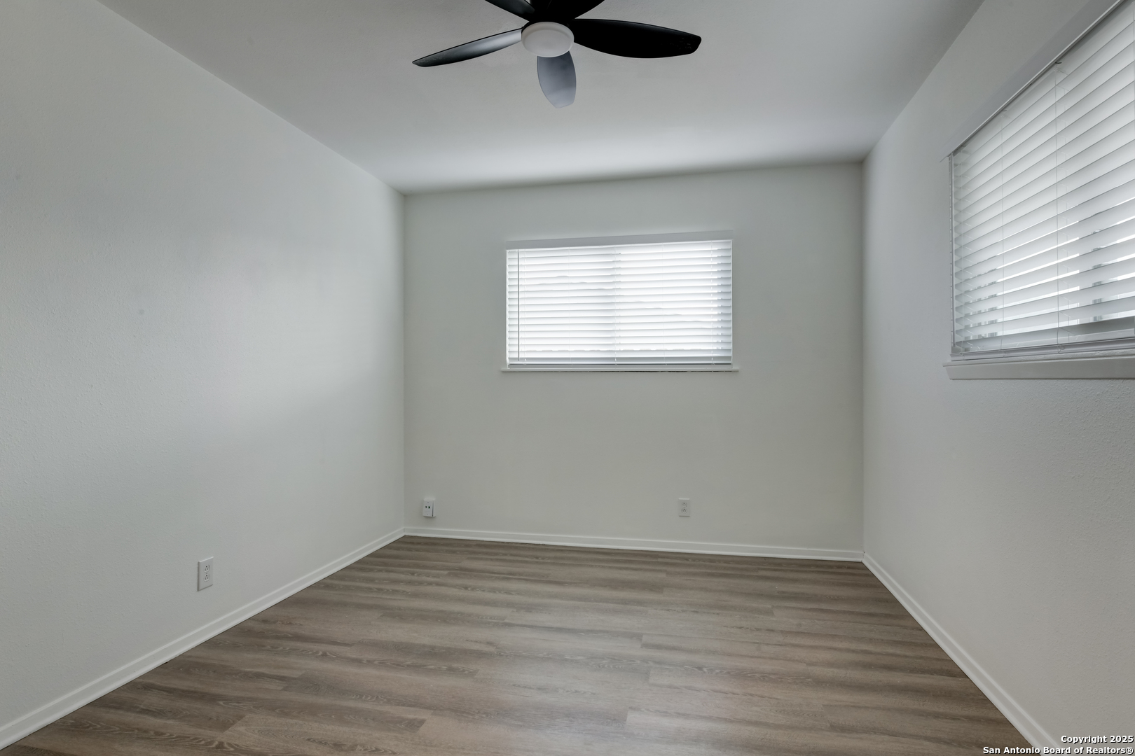 1044 Richmond Drive Schertz, TX 78154 - Photo 14 of 23 wooden floor in an empty room with a window
