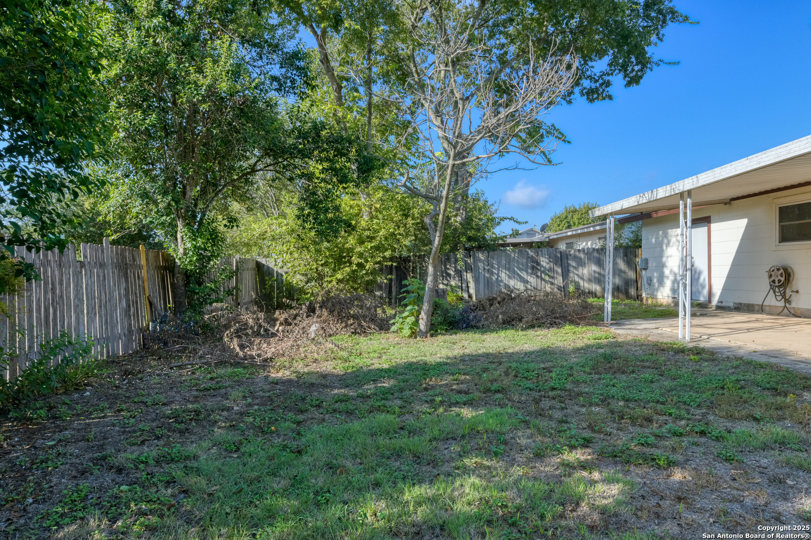 1044 Richmond Drive Schertz, TX 78154 - Photo 23 of 23 a view of a backyard with a tree