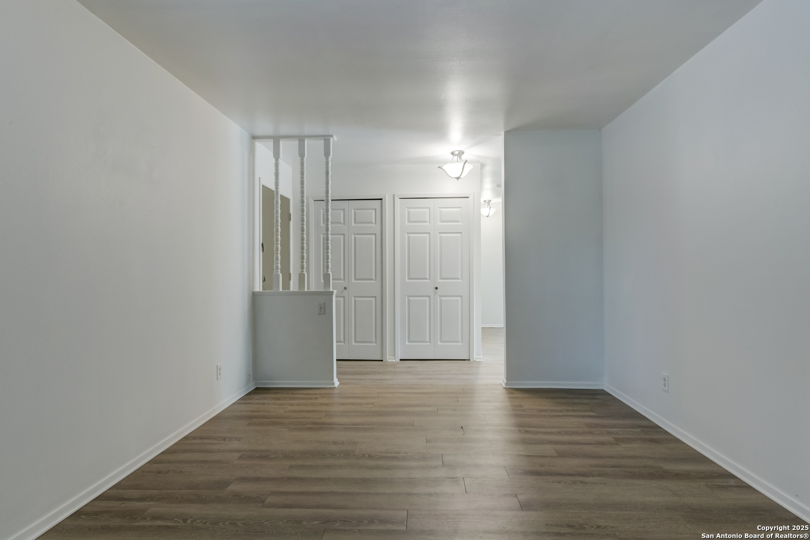 1044 Richmond Drive Schertz, TX 78154 - Photo 3 of 23 a view of empty room with wooden floor