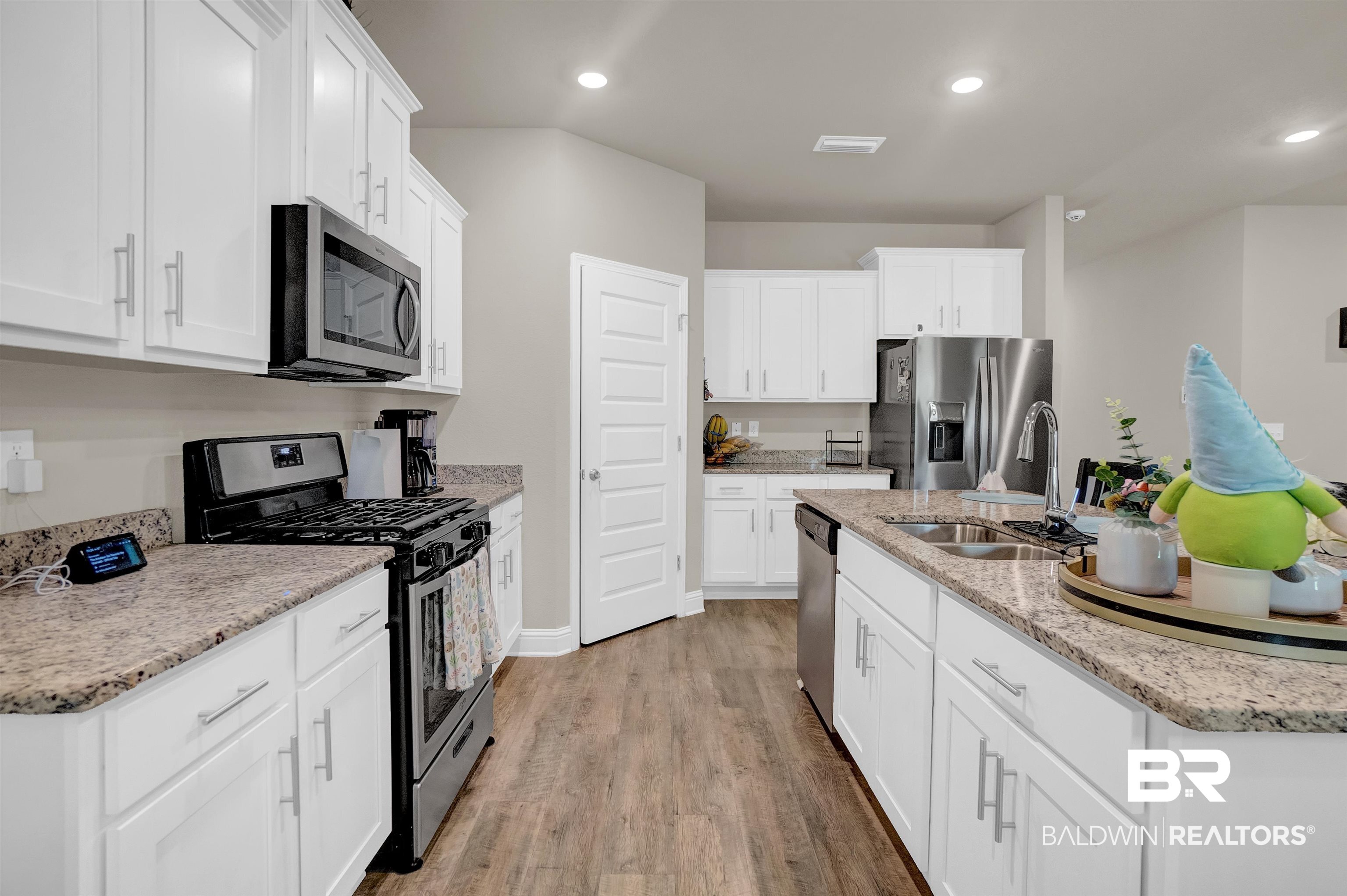 31671 Memphis Loop Daphne, AL 36527 - Photo 22 of 51 Kitchen featuring a sink, appliances with stainless steel finishes, a center island with sink, light wood-style floors, and recessed lighting