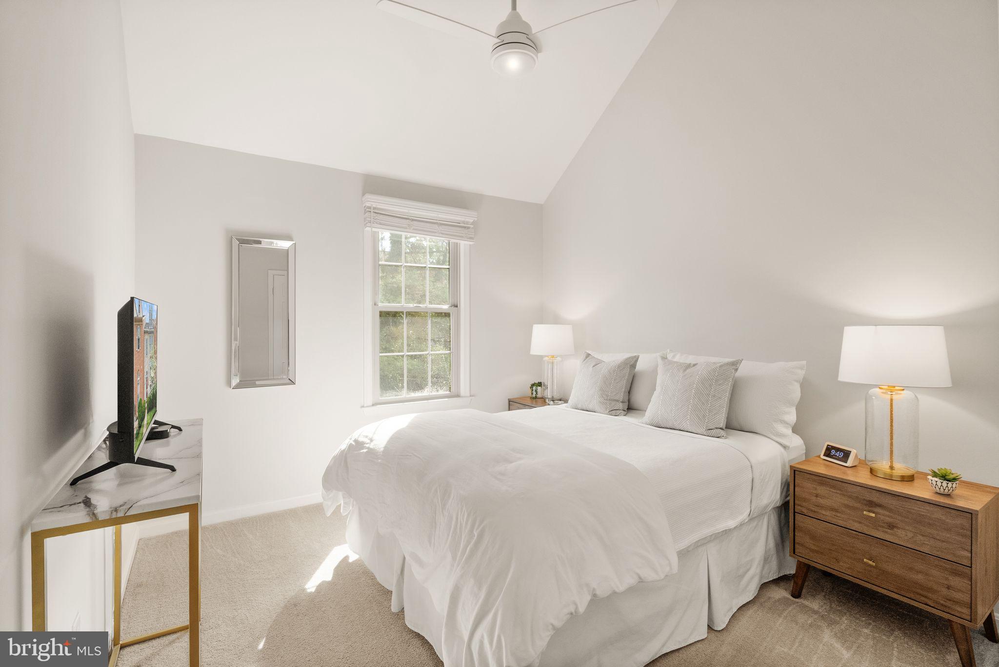 6369 English Ivy Way Springfield, VA 22152 - Photo 41 of 62 a bedroom with a bed and a flat screen tv