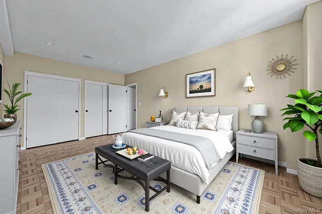 a bed room with a bed and a painting on the wall