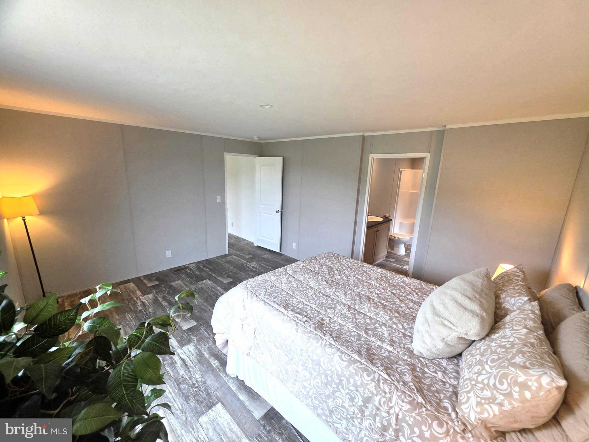 289 Grove Neck Road Earleville, MD 21919 - Photo 9 of 19 a bedroom with a bed and a mirror