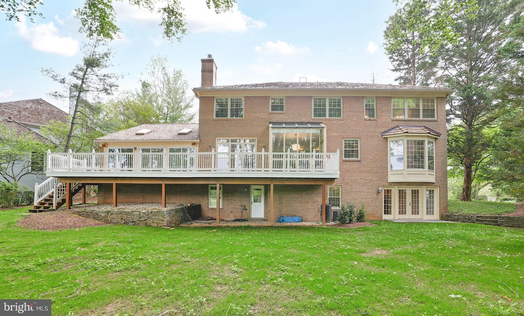 10104 Flower Gate Terrace Potomac, MD 20854 - Photo 31 of 34 a view of an house with backyard porch and garden