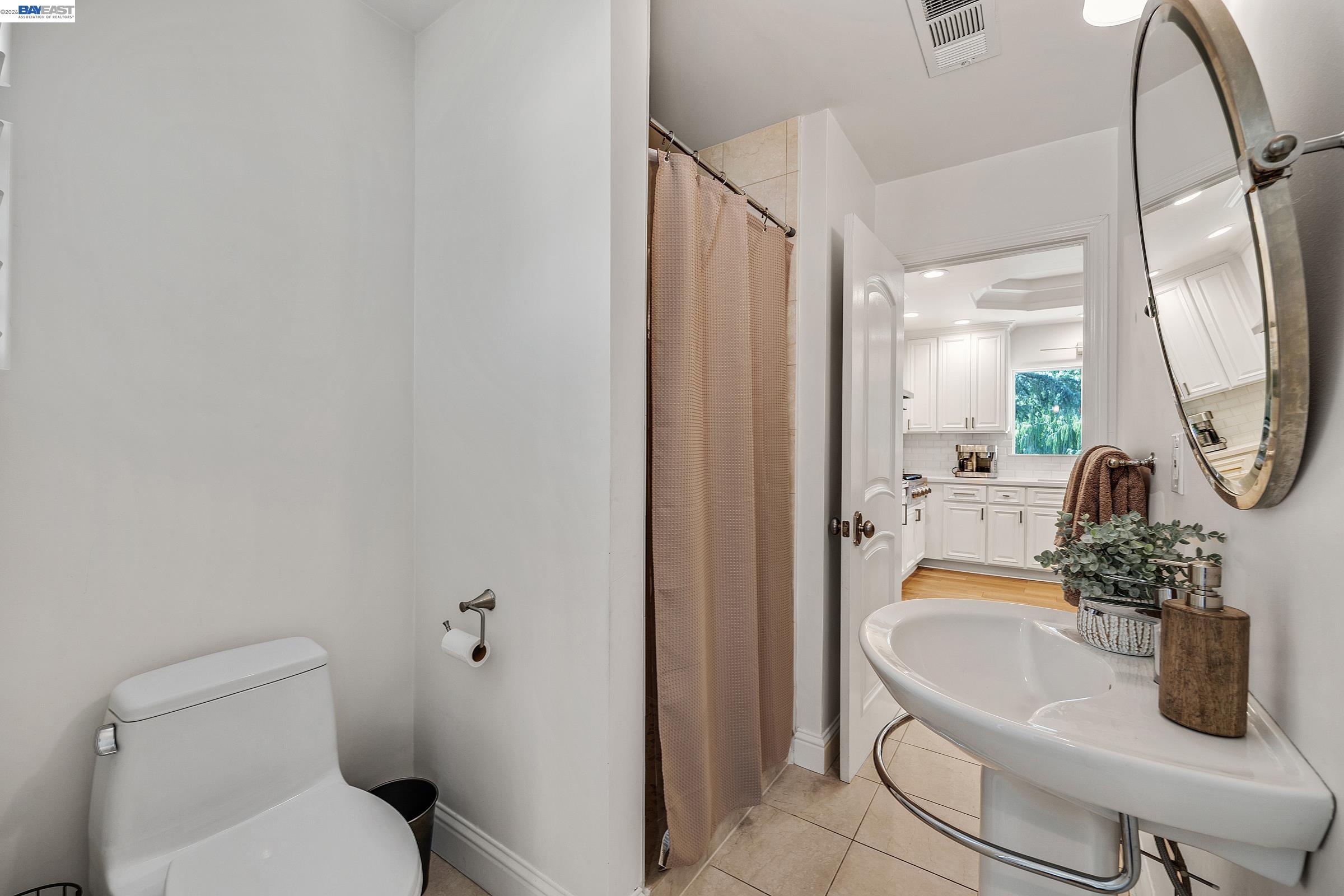 3144 Roundhill Road Alamo, CA 94507 - Photo 15 of 60 a bathroom with a sink a toilet and a mirror