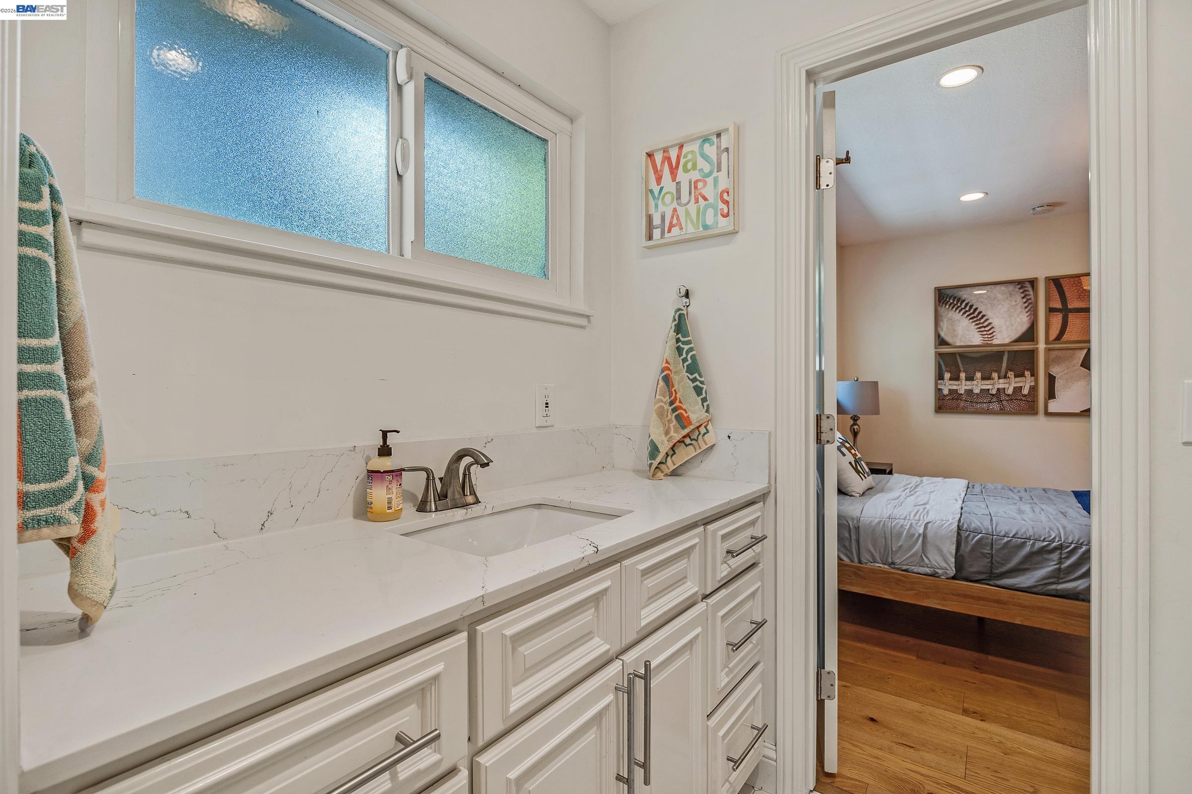 3144 Roundhill Road Alamo, CA 94507 - Photo 40 of 60 a en suite bathroom with a sink and a mirror