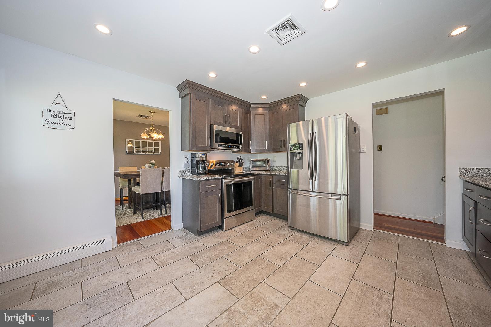 70 Hidden Valley Road Aston, PA 19014 - Photo 14 of 62 a kitchen with stainless steel appliances a refrigerator and a stove top oven
