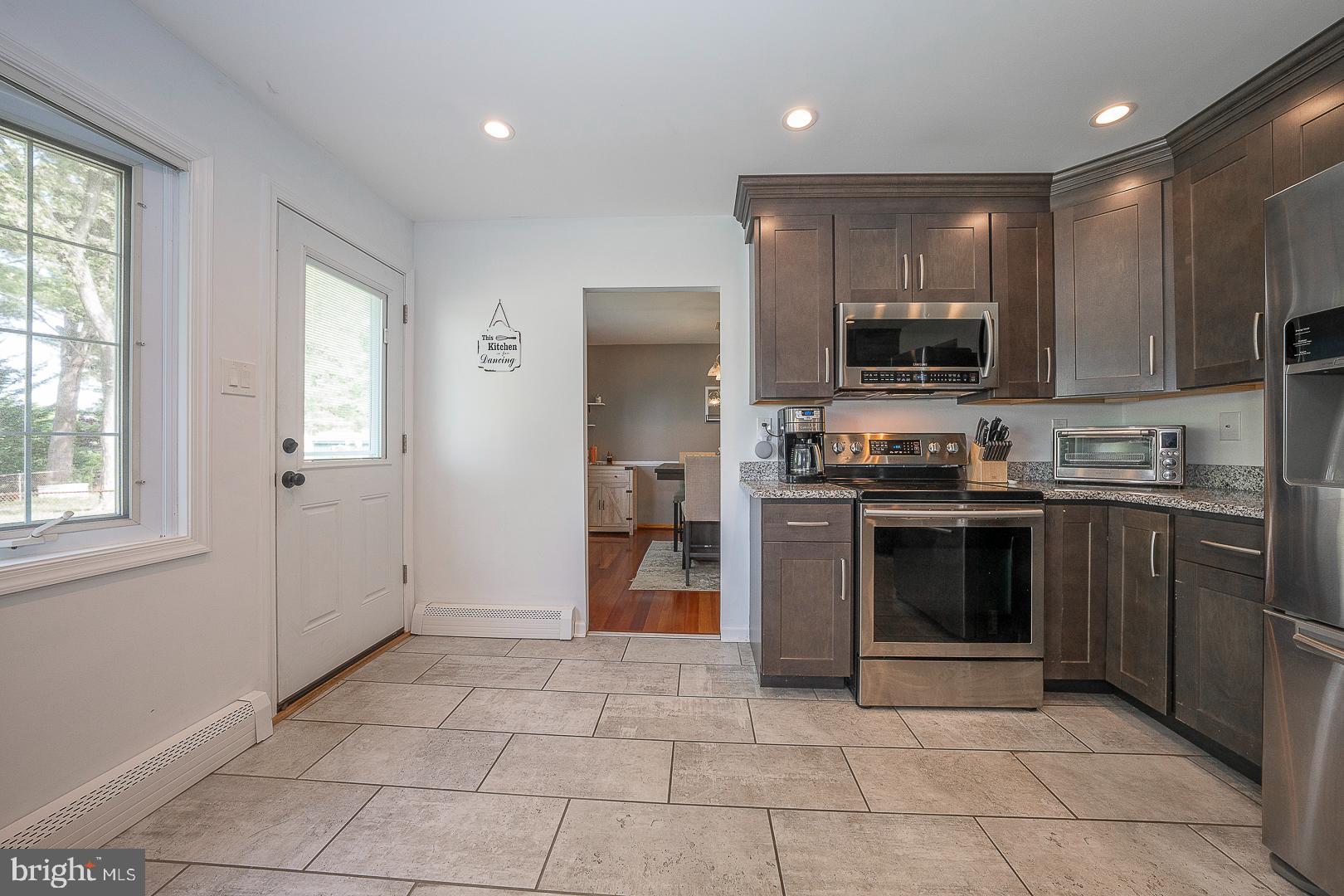 70 Hidden Valley Road Aston, PA 19014 - Photo 18 of 62 a kitchen with stainless steel appliances granite countertop a refrigerator and a stove top oven