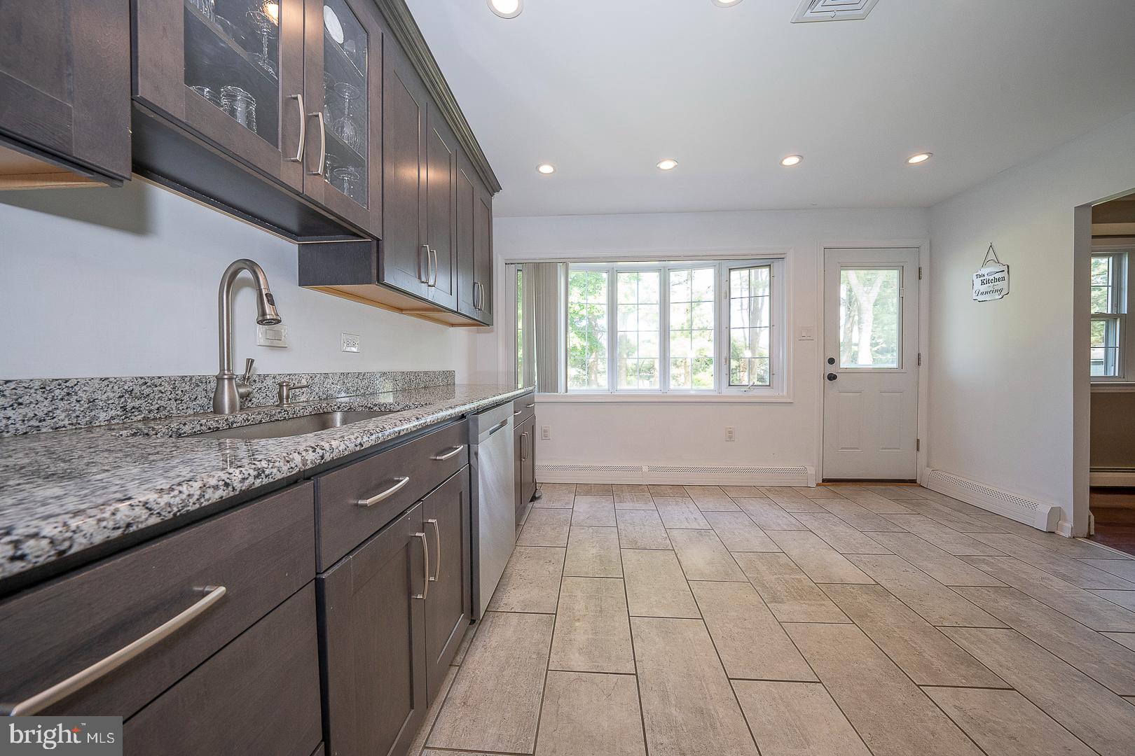 70 Hidden Valley Road Aston, PA 19014 - Photo 20 of 62 a kitchen with granite countertop a sink and cabinets