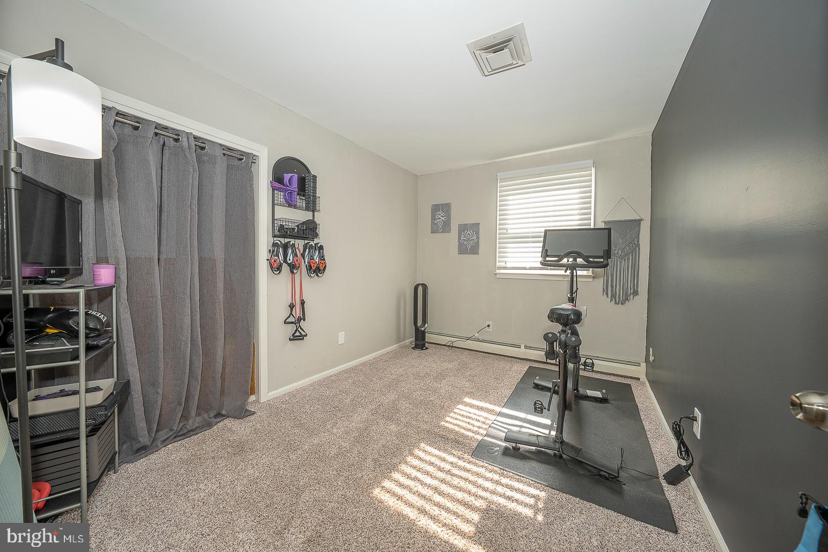 70 Hidden Valley Road Aston, PA 19014 - Photo 23 of 62 a view of a room with gym equipment and a window