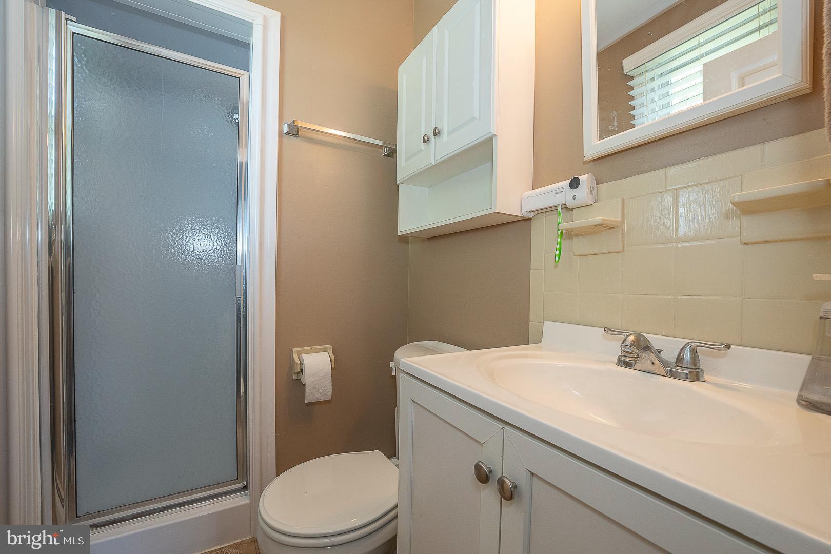 70 Hidden Valley Road Aston, PA 19014 - Photo 32 of 62 a bathroom with a sink a toilet and a mirror