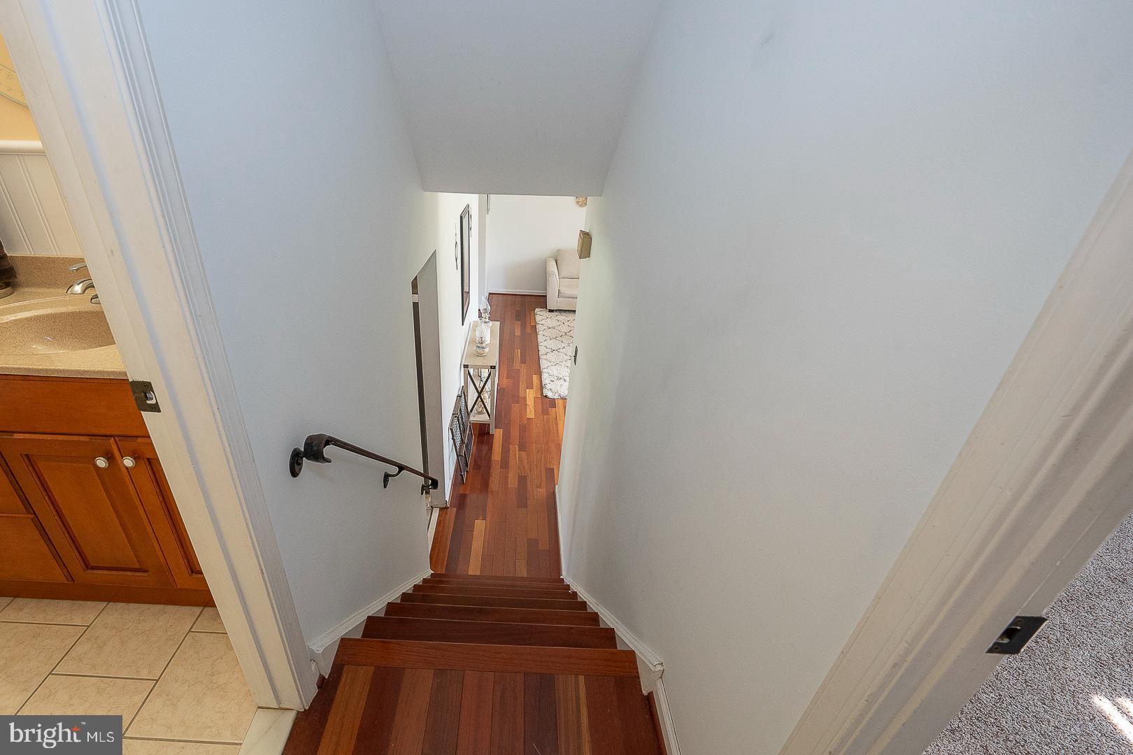 70 Hidden Valley Road Aston, PA 19014 - Photo 36 of 62 a view of a livingroom with wooden floor and stairs