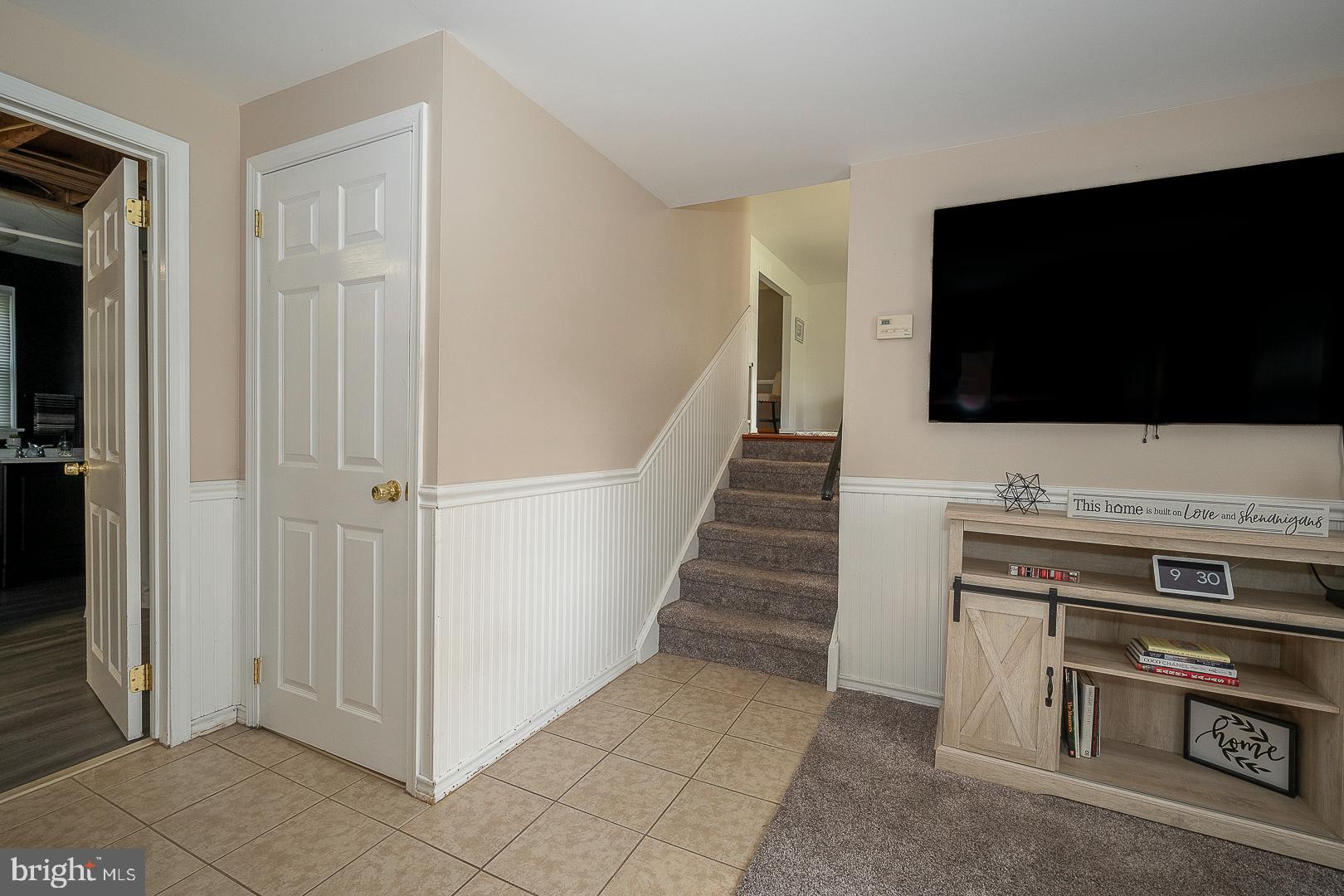70 Hidden Valley Road Aston, PA 19014 - Photo 38 of 62 a view of a livingroom with wooden floor a flat screen tv and entryway