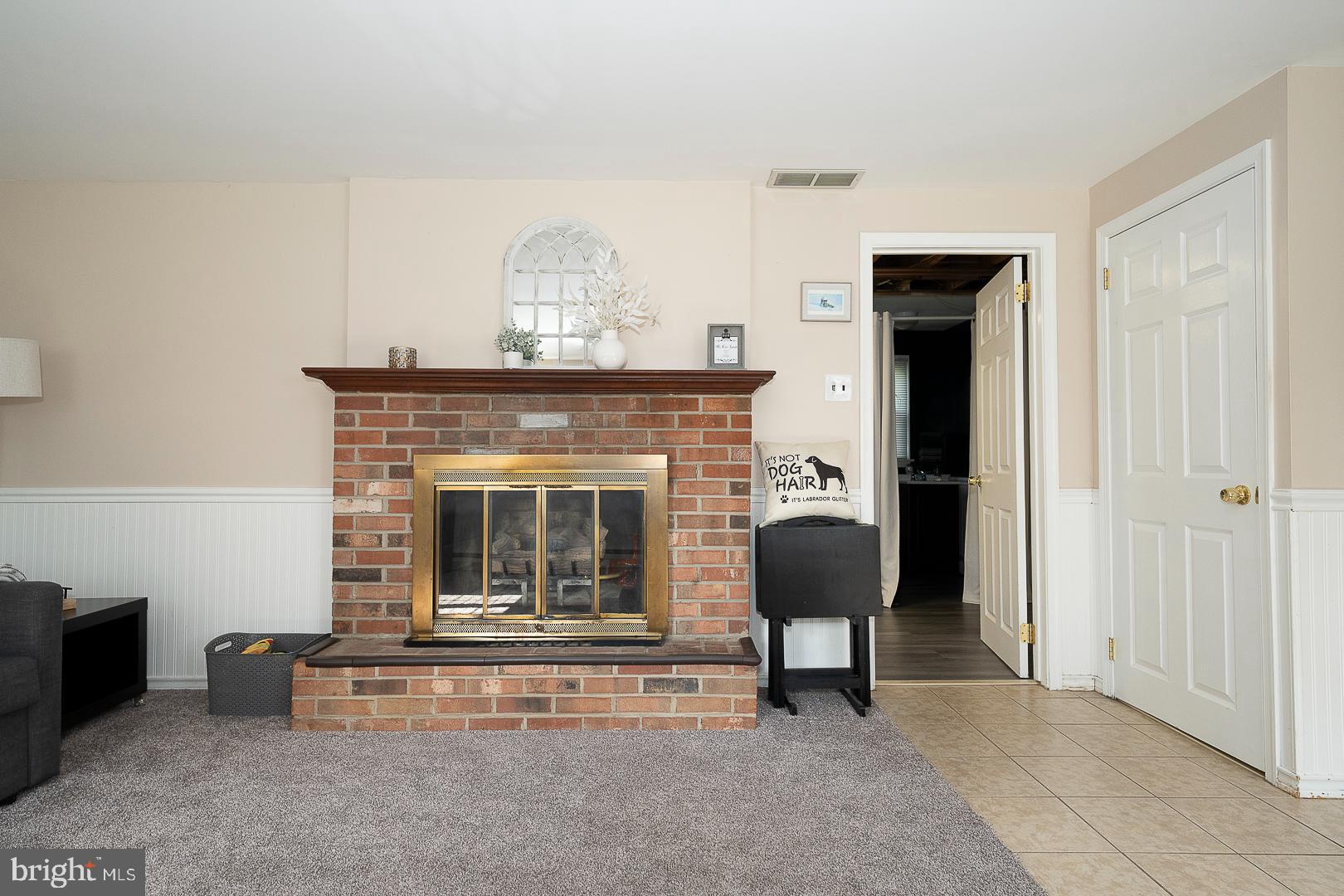 70 Hidden Valley Road Aston, PA 19014 - Photo 41 of 62 a living room with furniture and a fireplace