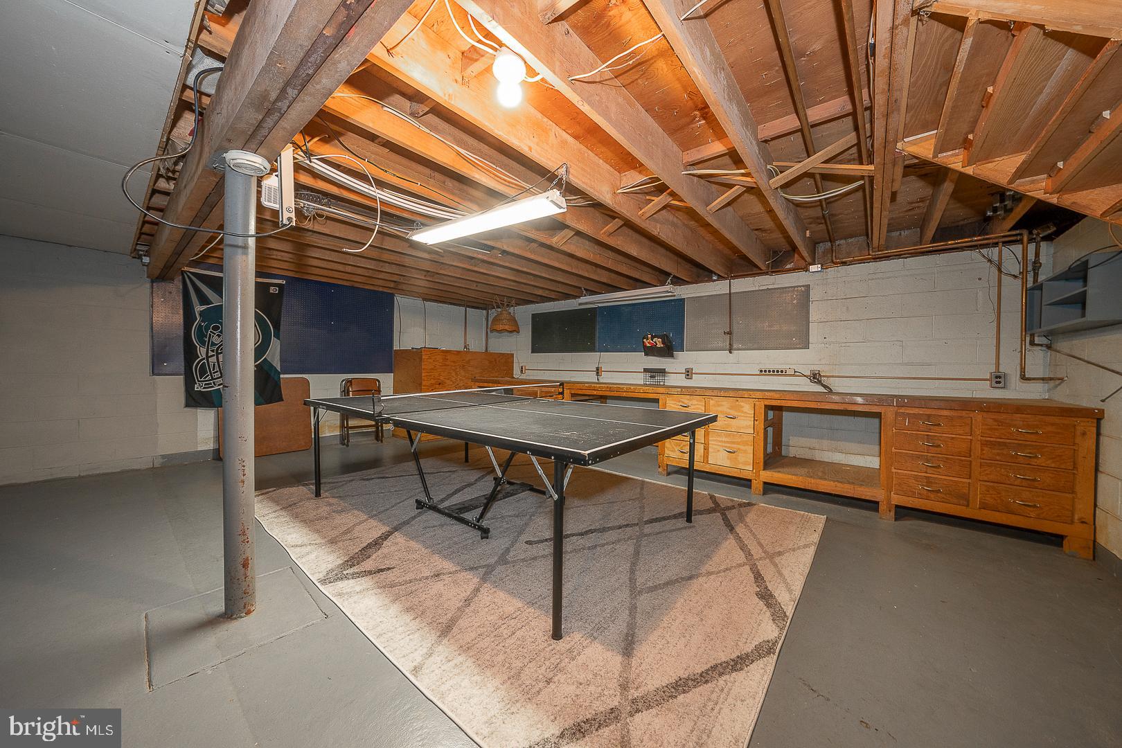 70 Hidden Valley Road Aston, PA 19014 - Photo 54 of 62 a room with table tennis table and wooden floor