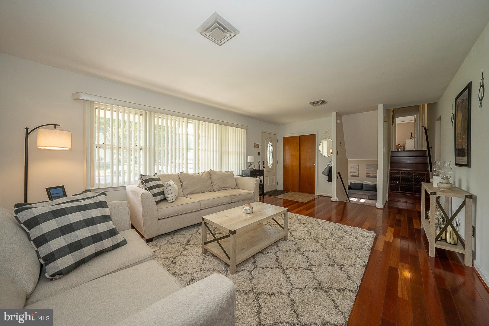 70 Hidden Valley Road Aston, PA 19014 - Photo 9 of 62 a living room with furniture a dining table and wooden floor