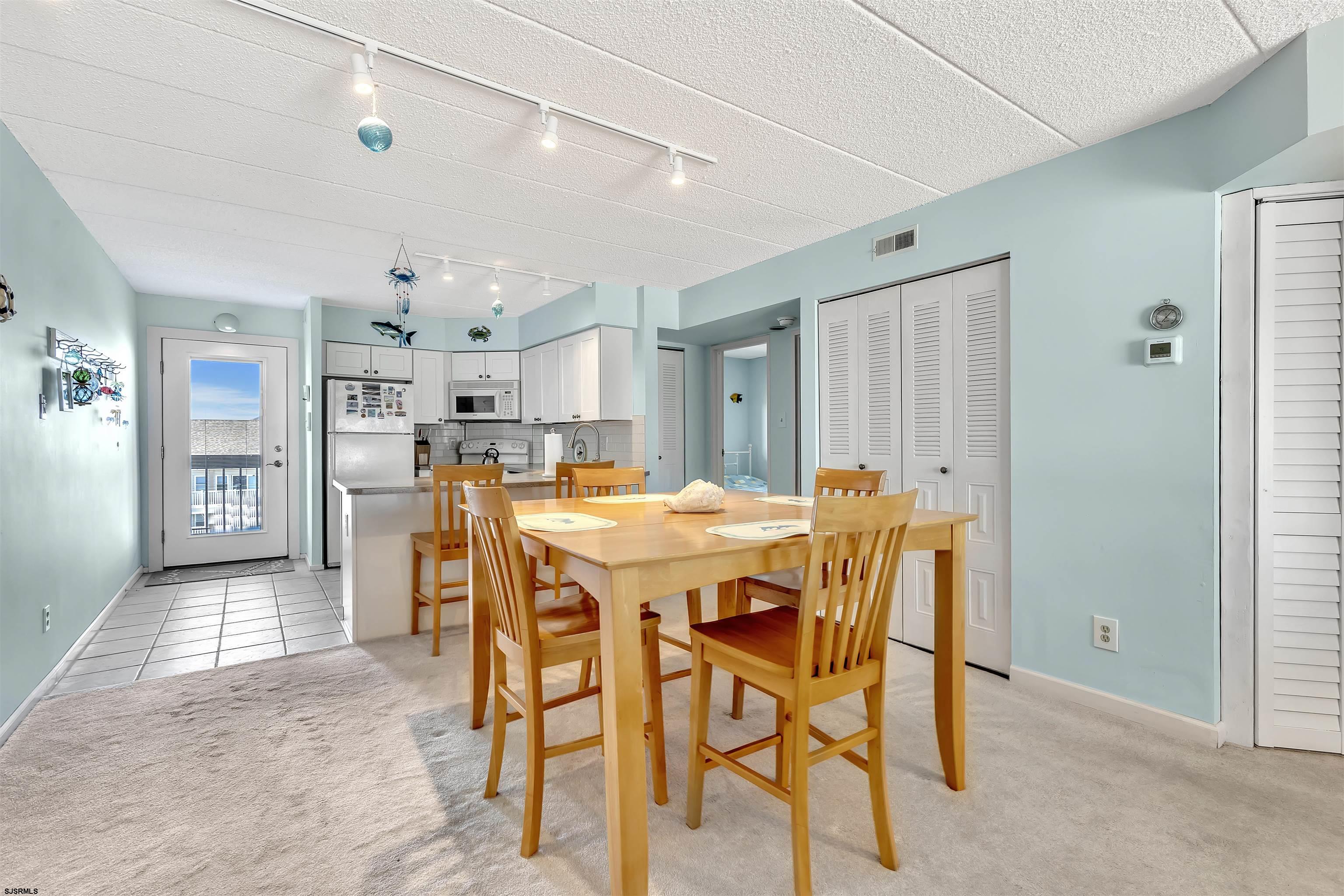 700 East Brigantine Avenue, Unit 2B Brigantine, NJ 08203 - Photo 11 of 36 a dining room with furniture and window