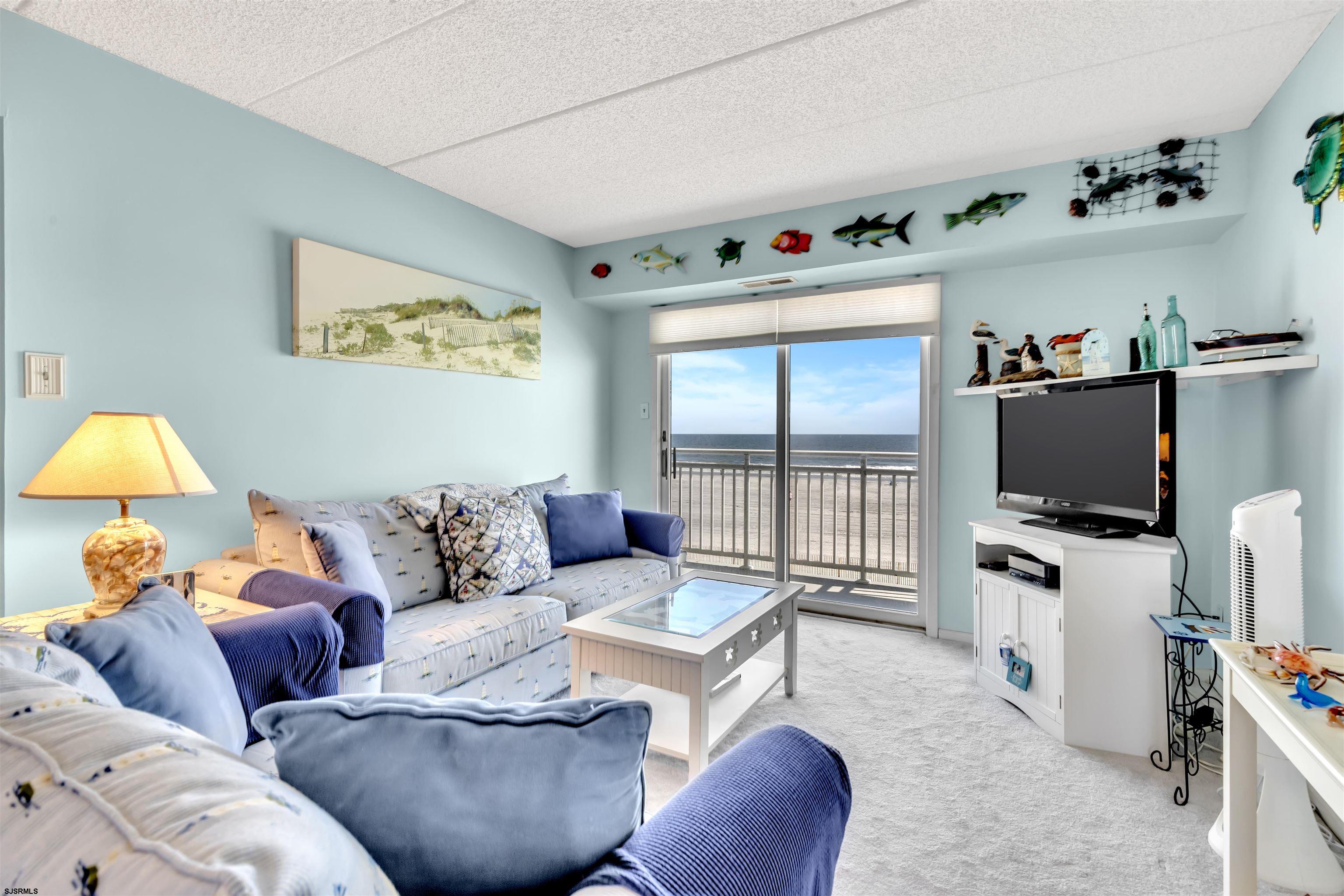 700 East Brigantine Avenue, Unit 2B Brigantine, NJ 08203 - Photo 13 of 36 a living room with furniture and a flat screen tv