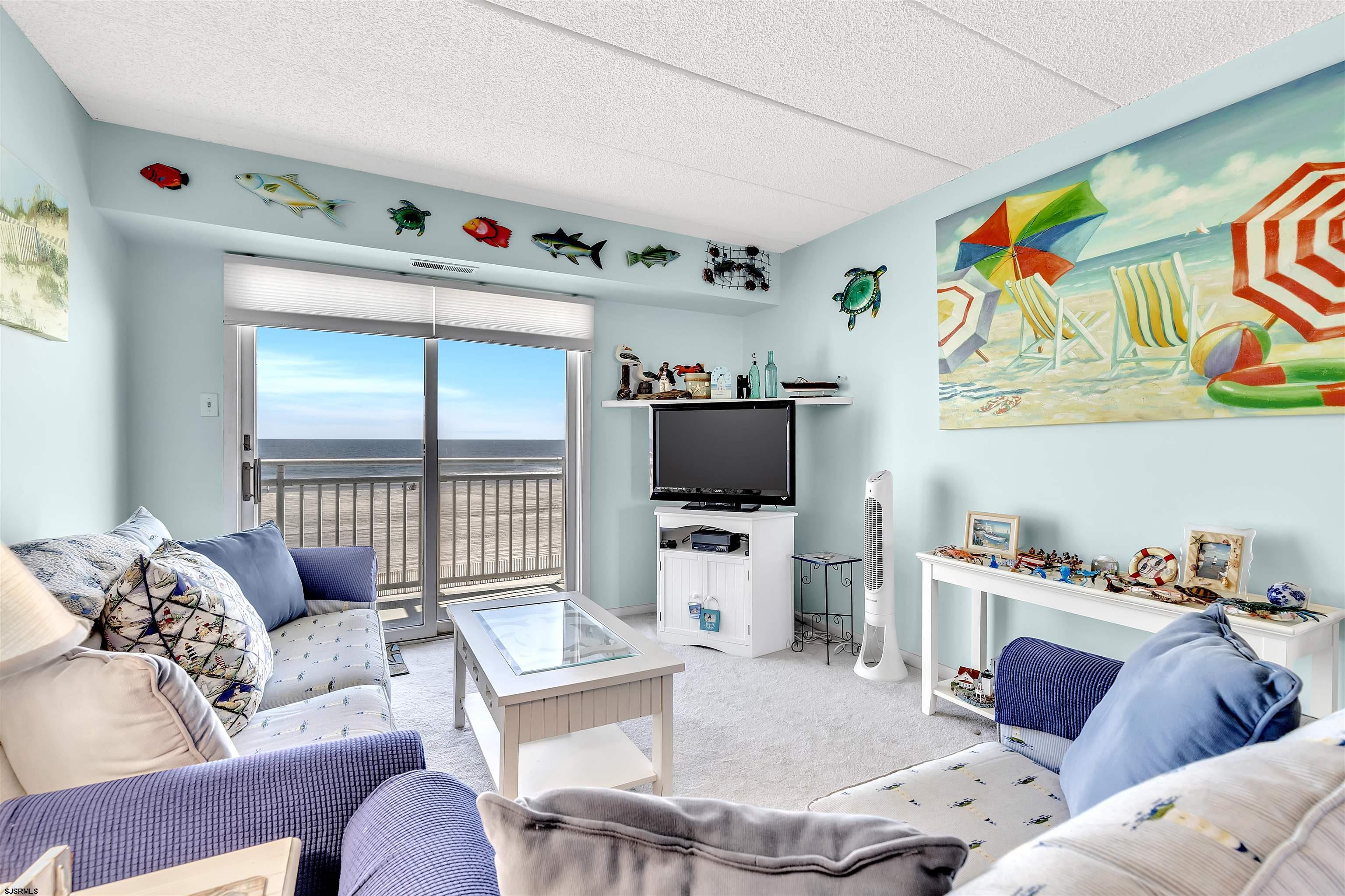 700 East Brigantine Avenue, Unit 2B Brigantine, NJ 08203 - Photo 14 of 36 a living room with furniture and a flat screen tv