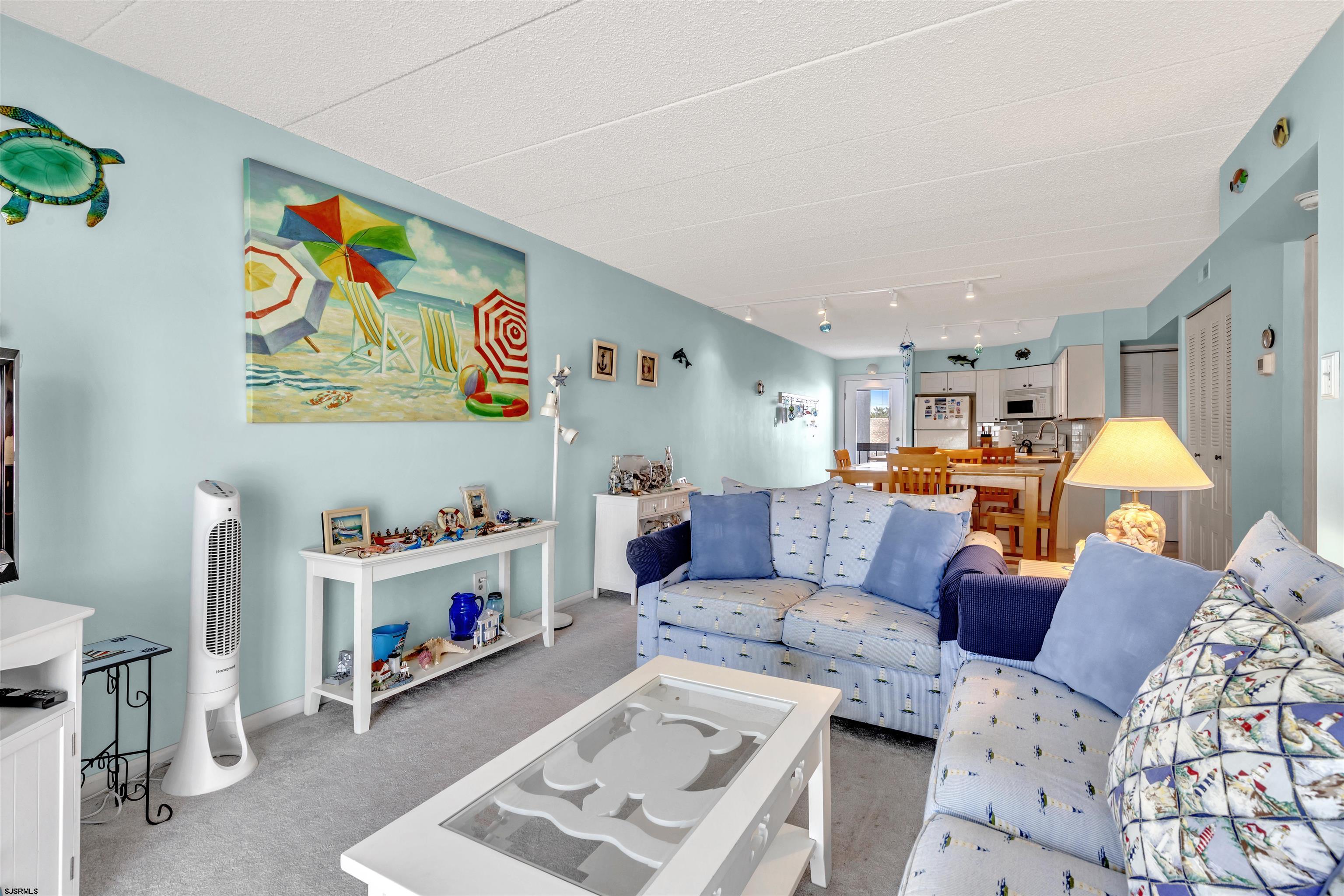 700 East Brigantine Avenue, Unit 2B Brigantine, NJ 08203 - Photo 15 of 36 a living room with furniture and a baby crib