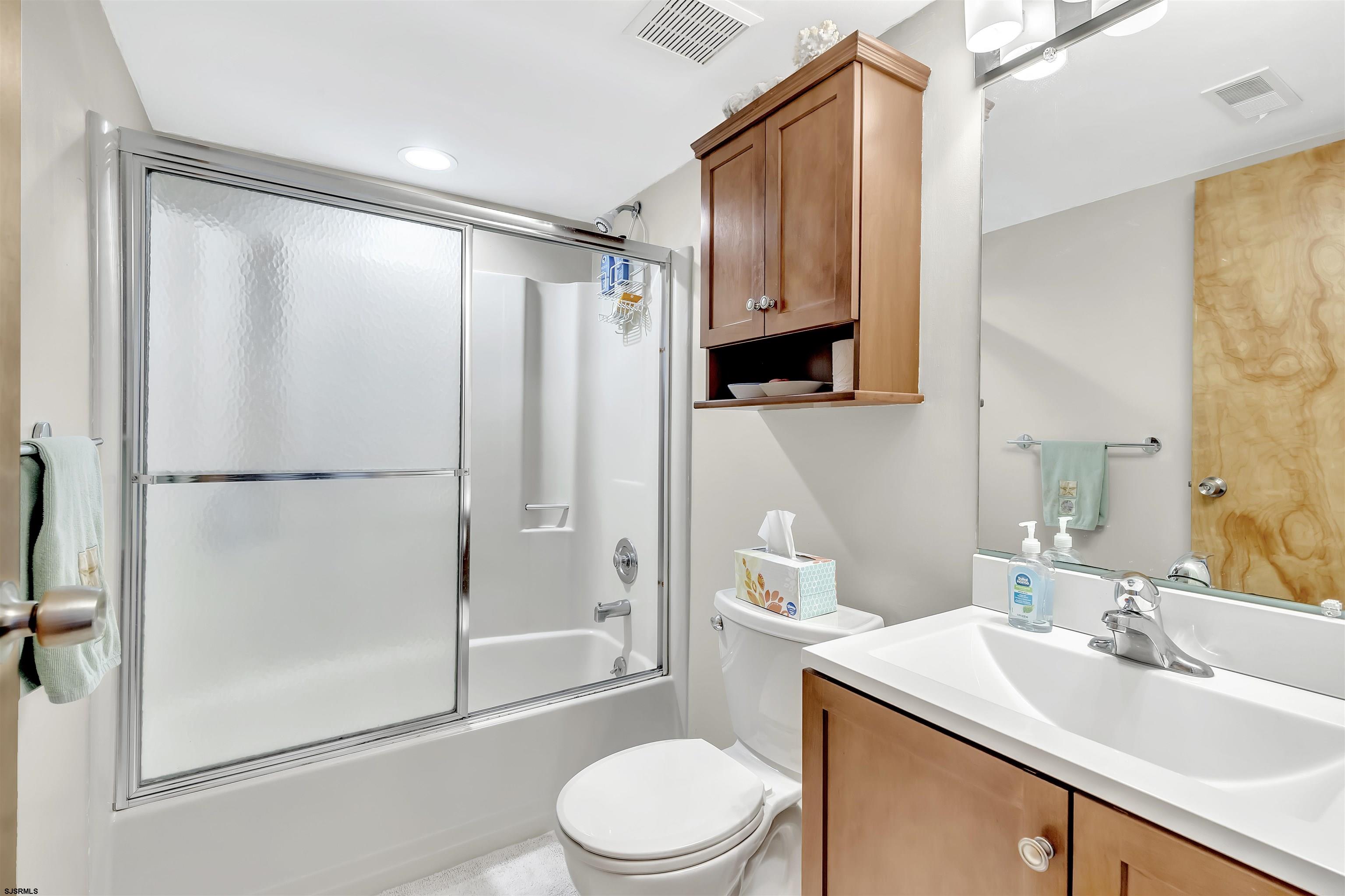 700 East Brigantine Avenue, Unit 2B Brigantine, NJ 08203 - Photo 17 of 36 a bathroom with a sink toilet and shower