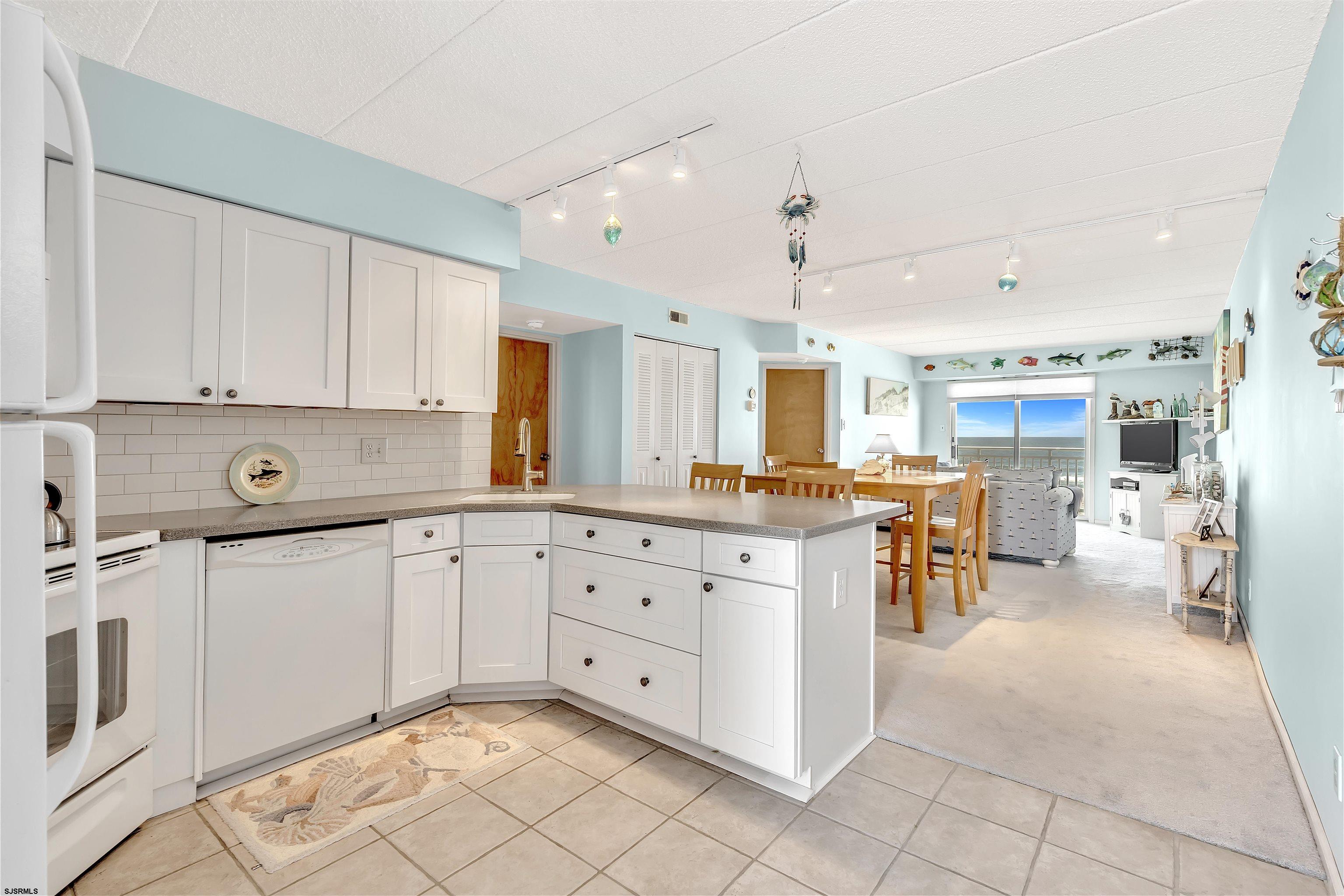 700 East Brigantine Avenue, Unit 2B Brigantine, NJ 08203 - Photo 4 of 36 a large white kitchen with a large window
