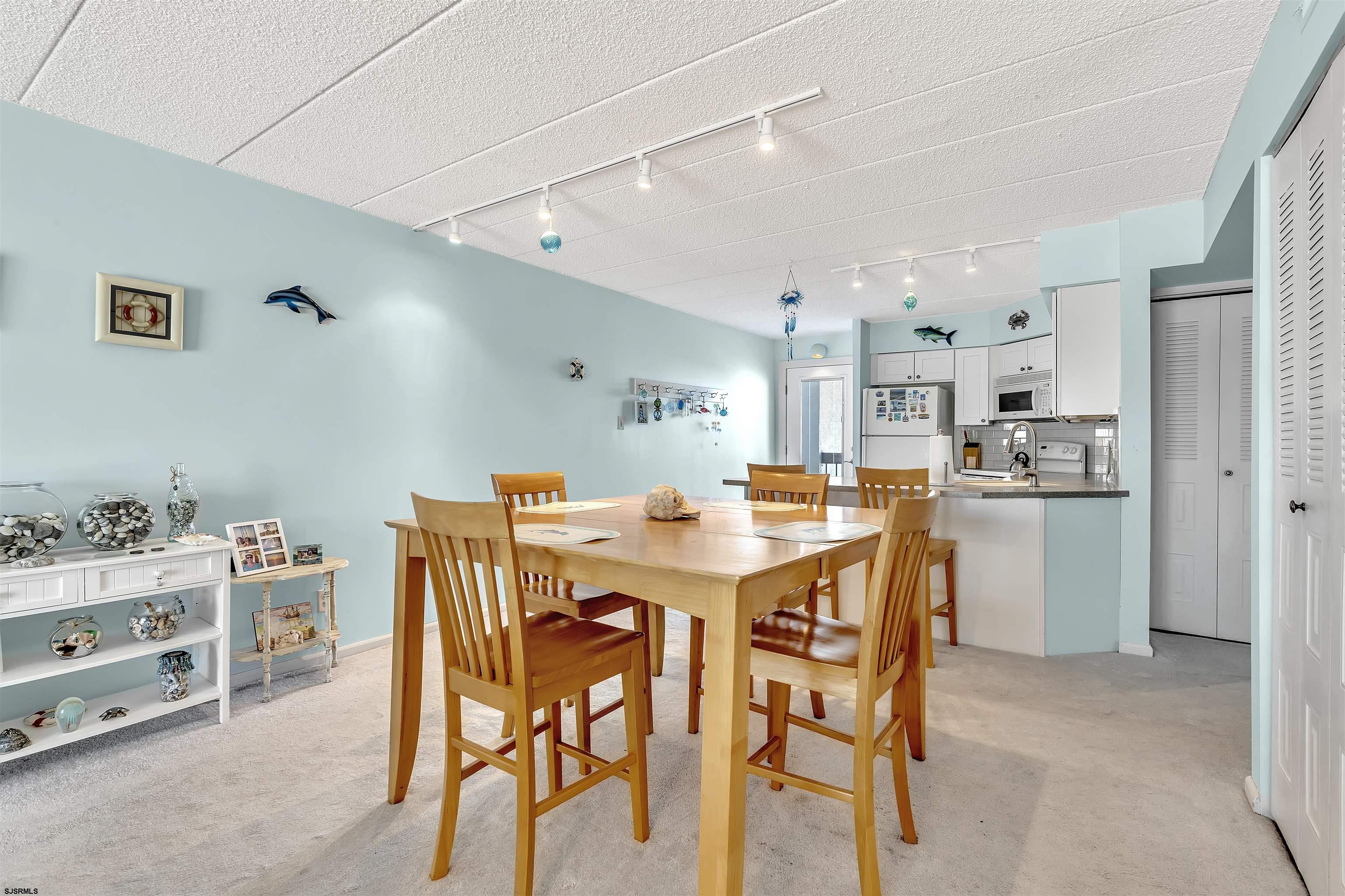 700 East Brigantine Avenue, Unit 2B Brigantine, NJ 08203 - Photo 9 of 36 a view of a dining room with furniture