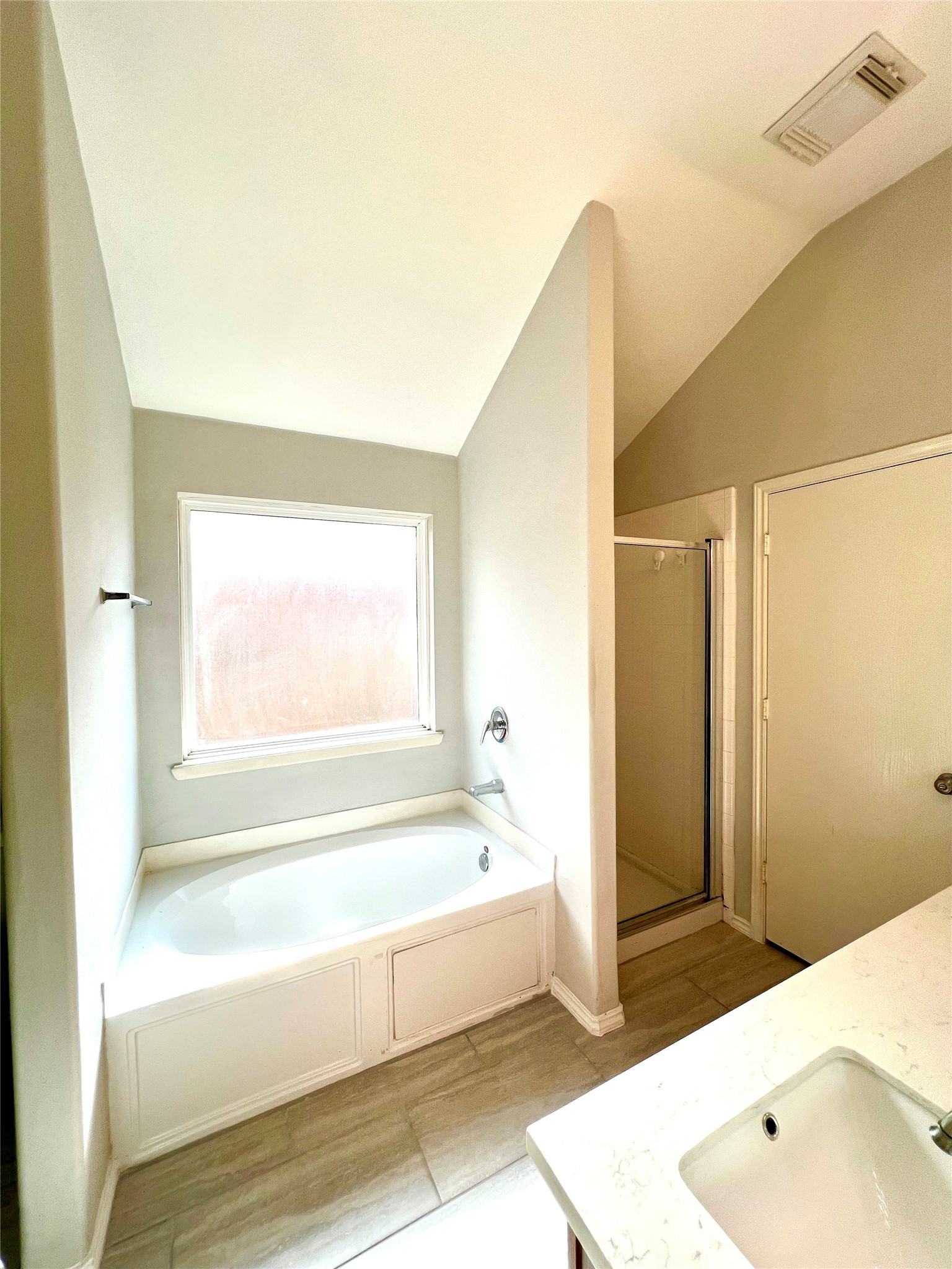 4414 Kulkarni Street Houston, TX 77045 - Photo 16 of 18 a bathroom with a tub shower and a sink