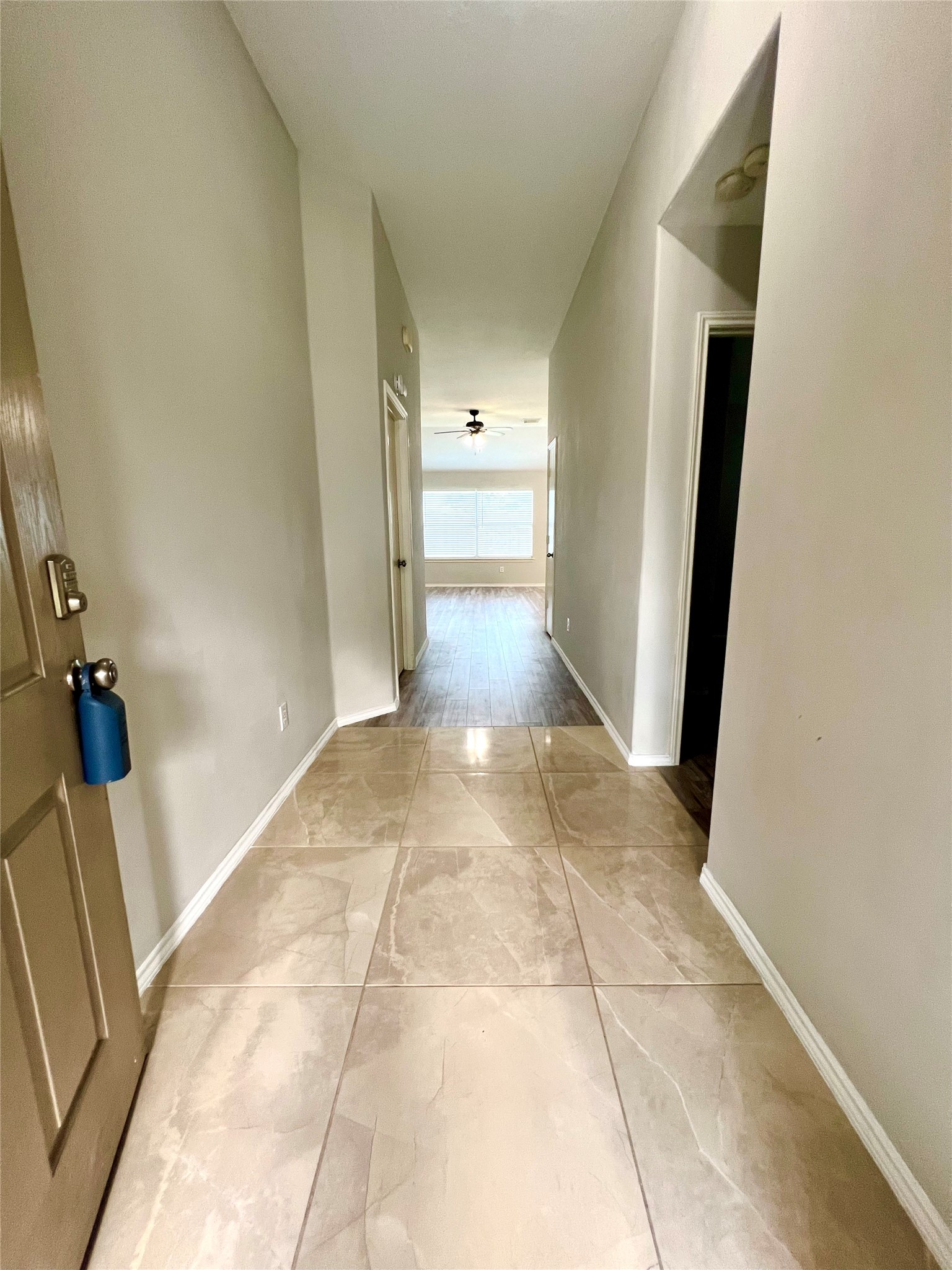 4414 Kulkarni Street Houston, TX 77045 - Photo 3 of 18 a view of a hallway