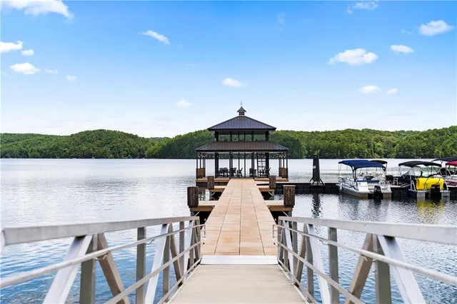 a roof deck view with a lake view
