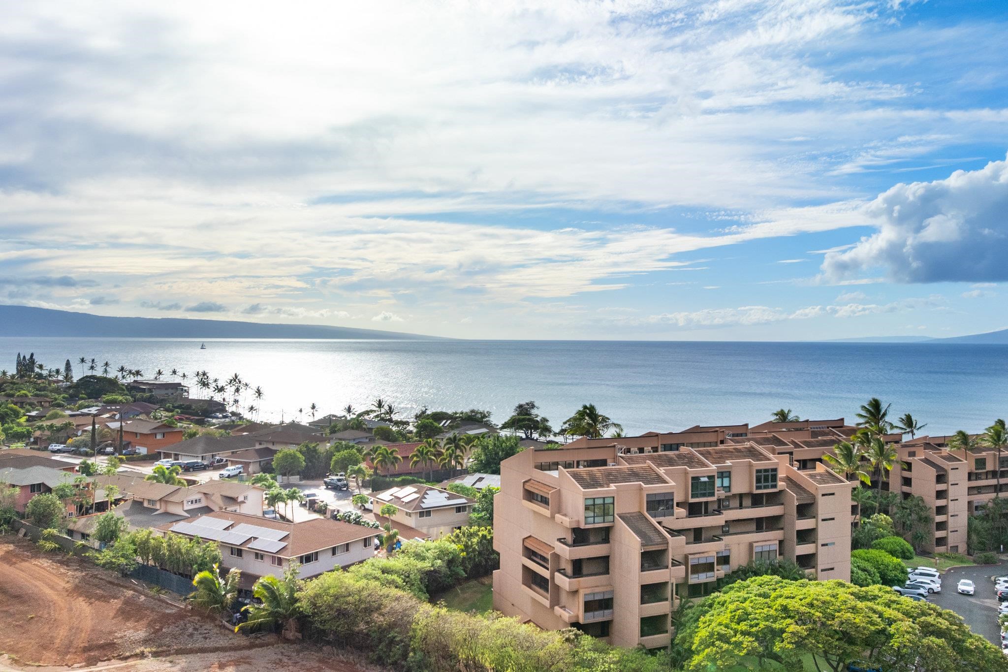 4242 Lower Honoapiilani Road, Unit E304 Lahaina, HI 96761 - Photo 28 of 34 an aerial view of multiple house