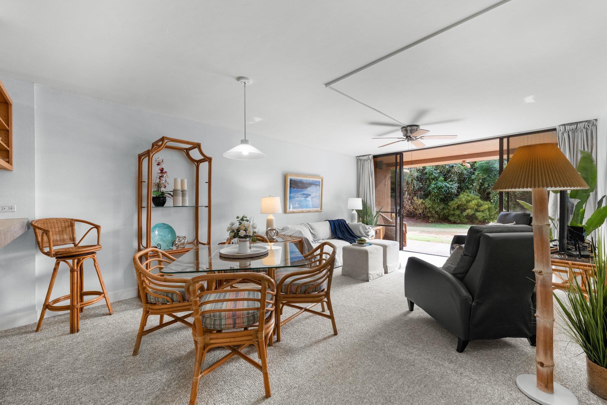 4242 Lower Honoapiilani Road, Unit E304 Lahaina, HI 96761 - Photo 3 of 34 a dining room with furniture and wooden floor