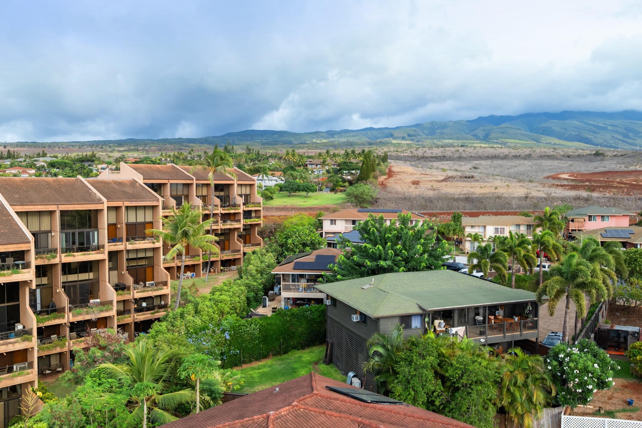 4242 Lower Honoapiilani Road, Unit E304 Lahaina, HI 96761 - Photo 32 of 34 an aerial view of a house with a yard