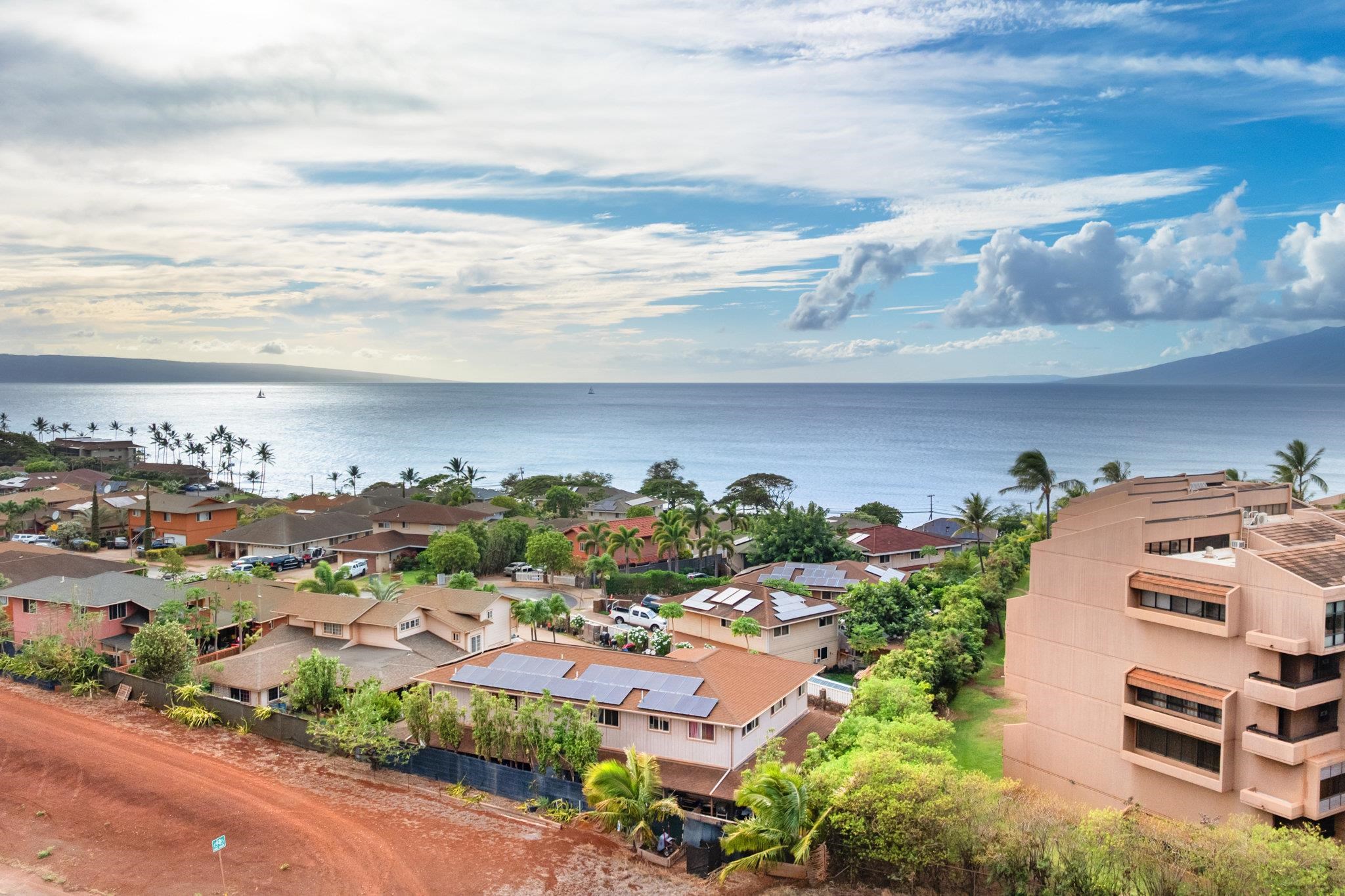 4242 Lower Honoapiilani Road, Unit E304 Lahaina, HI 96761 - Photo 34 of 34 an aerial view of multiple houses with yard