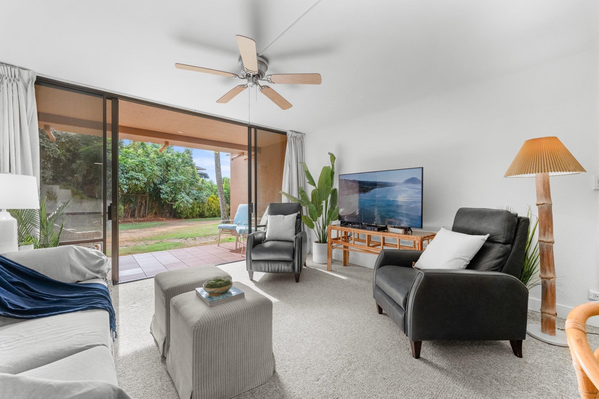 4242 Lower Honoapiilani Road, Unit E304 Lahaina, HI 96761 - Photo 8 of 34 a living room with furniture and a large window