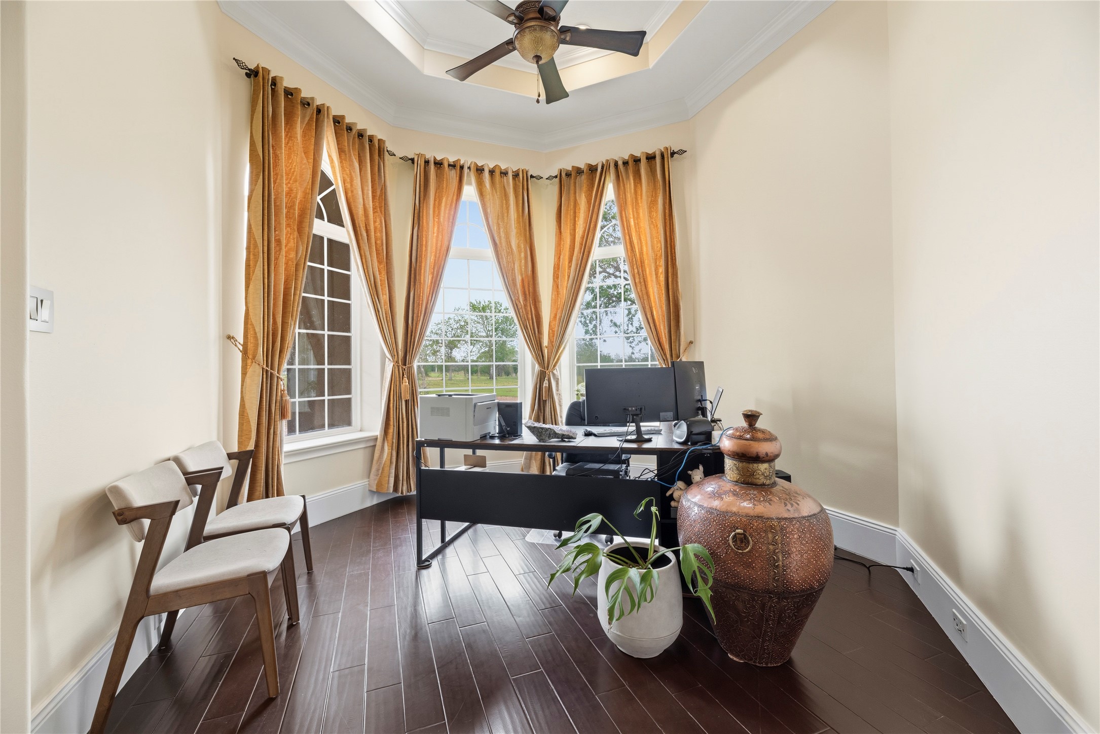 6306 Farm To Market 359 Fulshear, TX 77441 - Photo 11 of 44 Arched windows and a dedicated sitting area create an inspiring environment in this custom home office, which is fully wired with CAT5 and coax for professional connectivity.