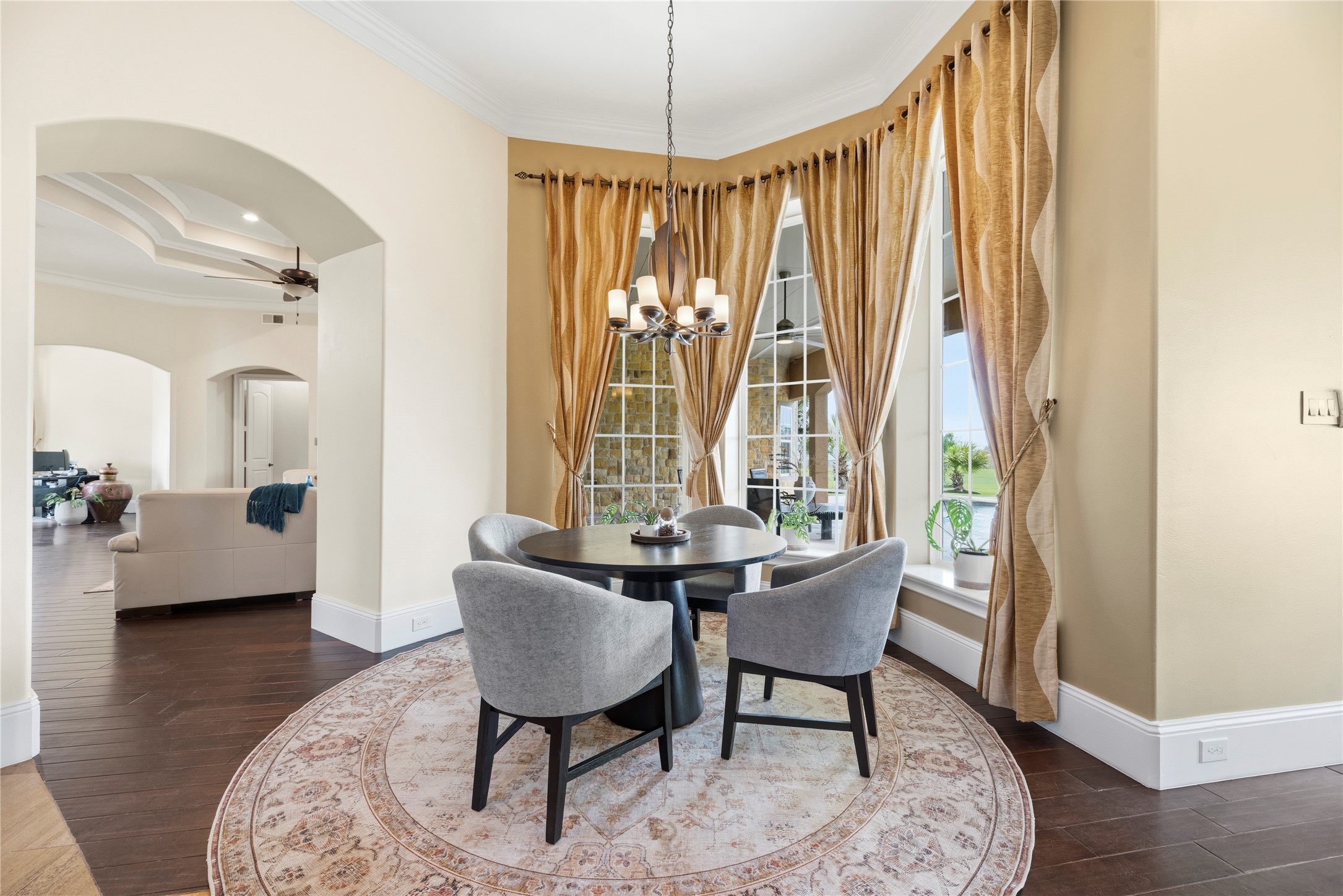 6306 Farm To Market 359 Fulshear, TX 77441 - Photo 16 of 44 Situated adjacent to the gourmet kitchen, this bright morning room features crown molding and a large bay of windows that provide a welcoming atmosphere for casual daily dining.