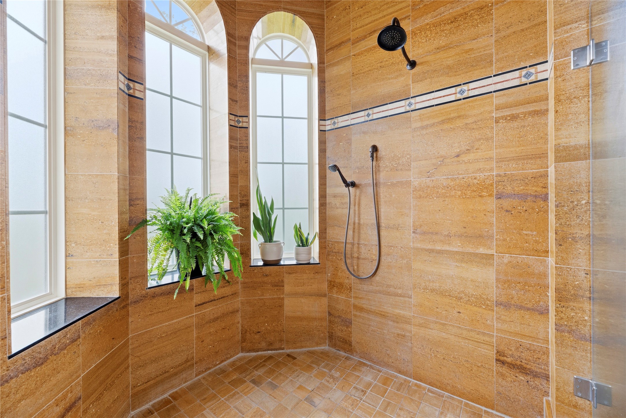 6306 Farm To Market 359 Fulshear, TX 77441 - Photo 20 of 44 The walk-in shower is encased in meticulously imported tile and features high-end PEX plumbing with a looped hot water system for immediate temperature control.