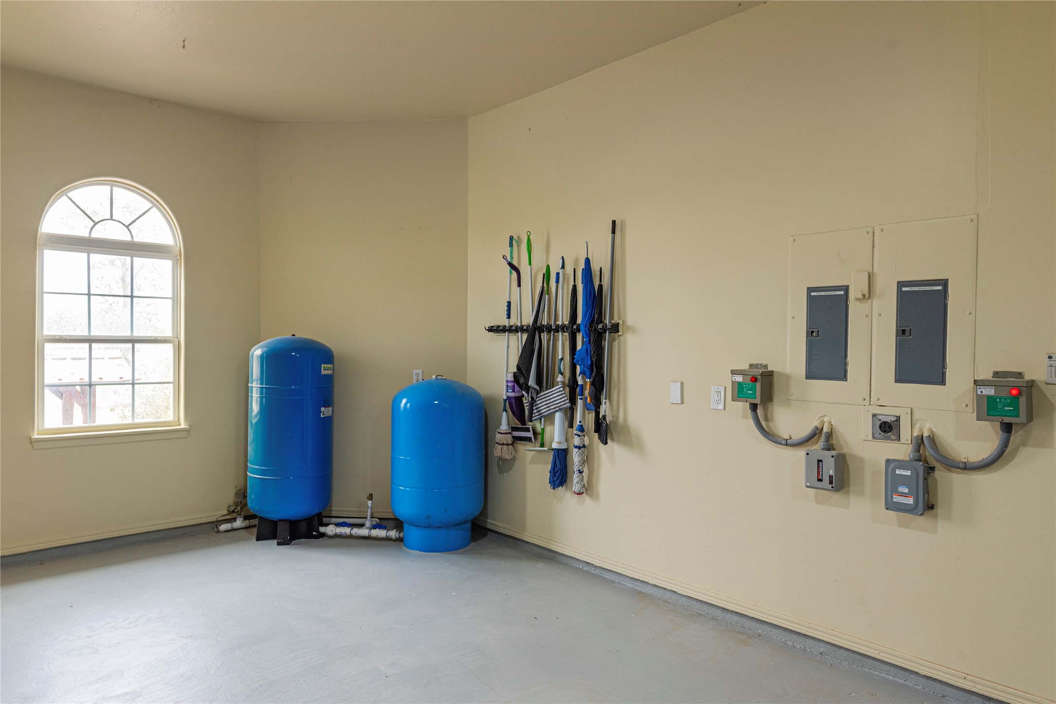 6306 Farm To Market 359 Fulshear, TX 77441 - Photo 35 of 44 The property’s advanced infrastructure includes a 400-amp electrical service, 20 kW automatic backup generator, and a sophisticated 4-zone geothermal control system for peak efficiency.