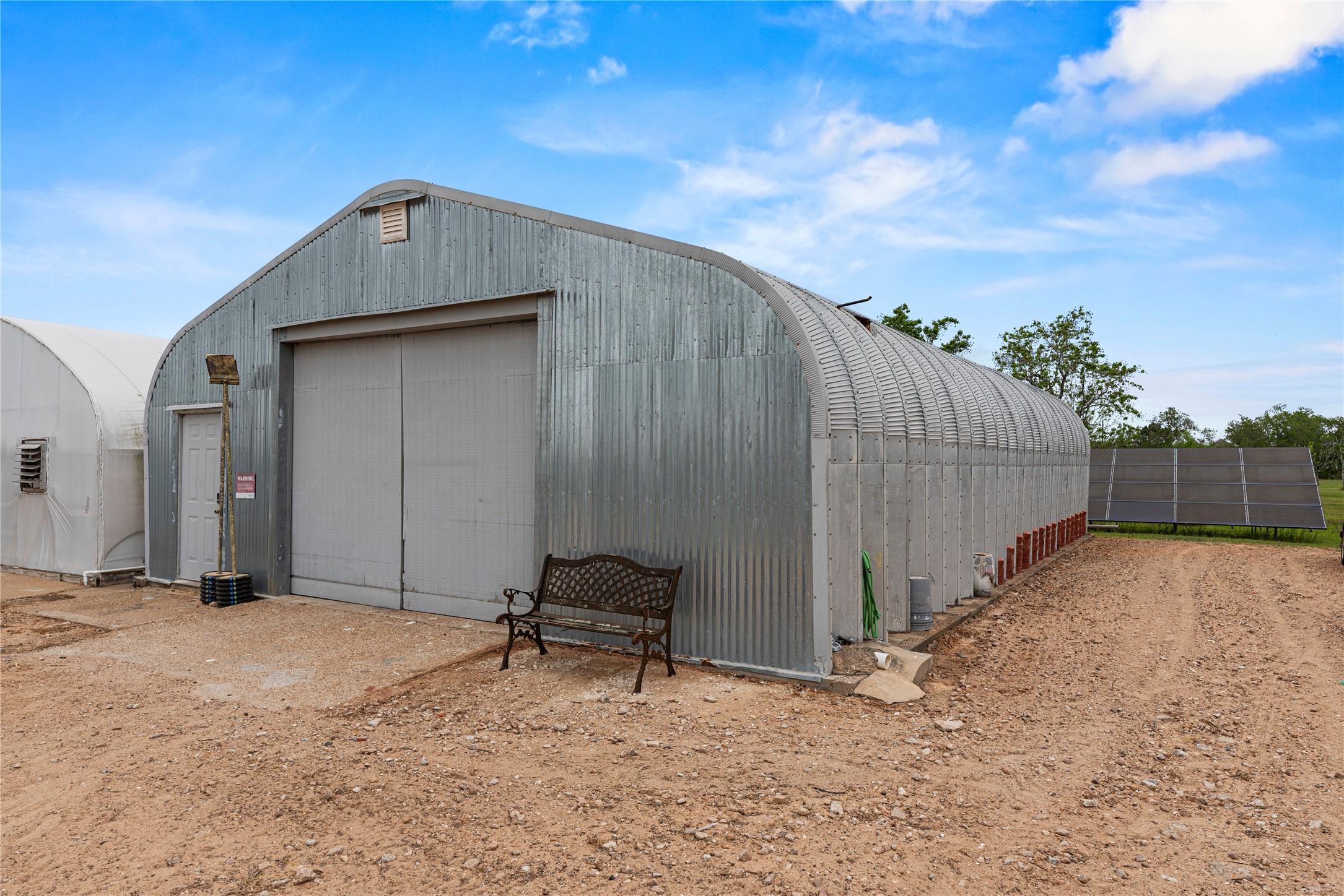 6306 Farm To Market 359 Fulshear, TX 77441 - Photo 36 of 44 This robust 1,500 sq. ft. barn offers a 30x50 footprint, wired with a 100-amp electrical service and utility water; please note the temporary greenhouse structure seen to the left of the barn will be removed prior to closing.
