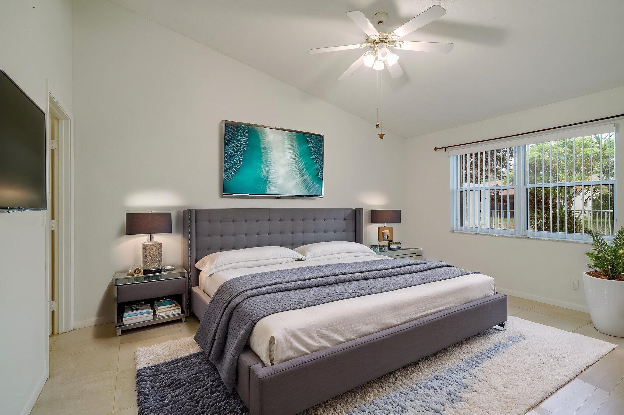 6209 Pond Tree Court Greenacres, FL 33463 - Photo 21 of 38 a bedroom with bed and a window