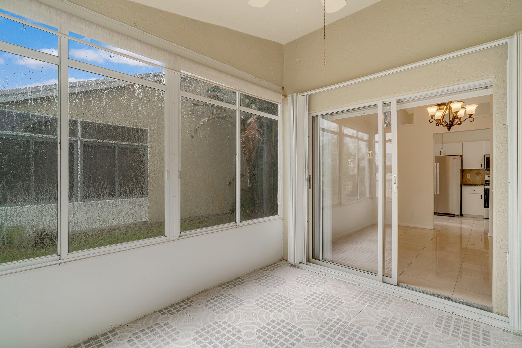 6209 Pond Tree Court Greenacres, FL 33463 - Photo 29 of 38 a view of an empty room with a window