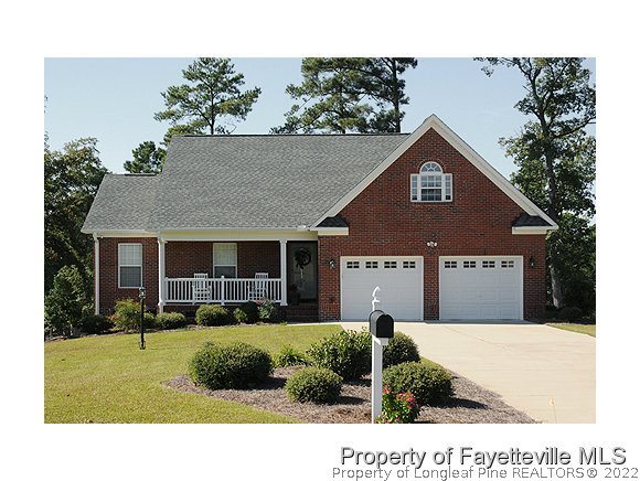 240 Lakeside Road Raeford, NC 28376 - Photo 1 of 16 a front view of a house with a yard