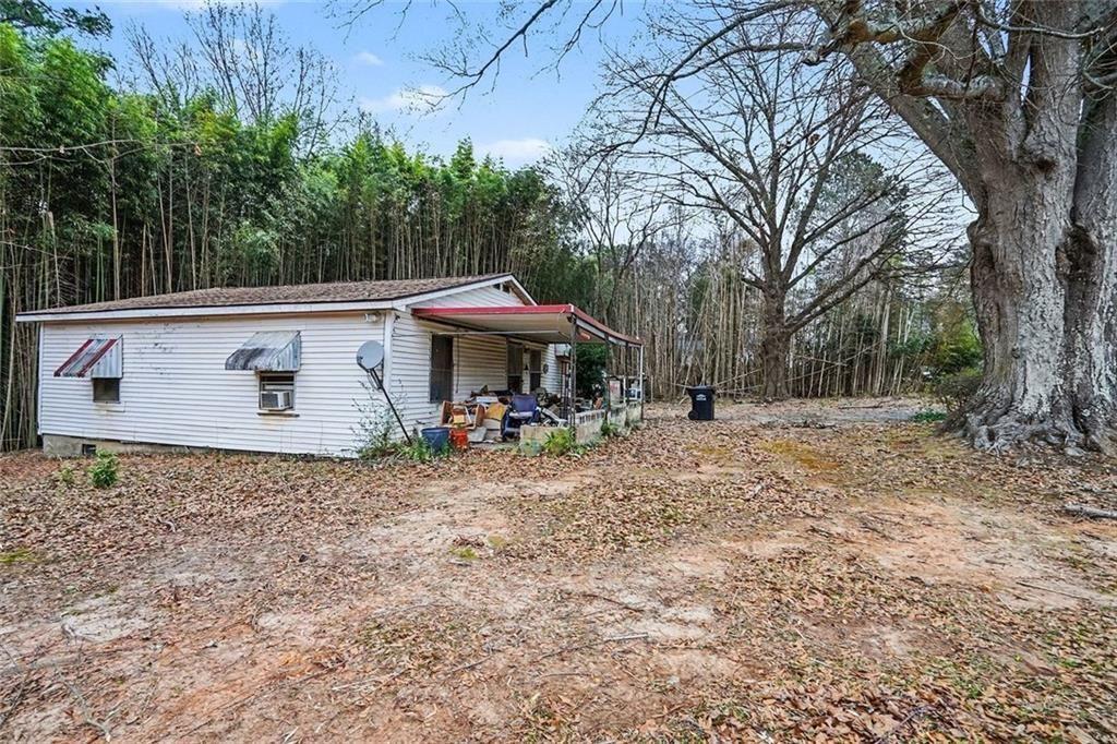 3580 Paul Samuel Road Northwest Kennesaw, GA 30152 - Photo 4 of 15 a view of a house with a yard