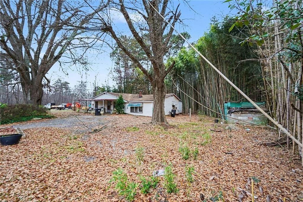 3580 Paul Samuel Road Northwest Kennesaw, GA 30152 - Photo 6 of 15 a view of a house with a yard
