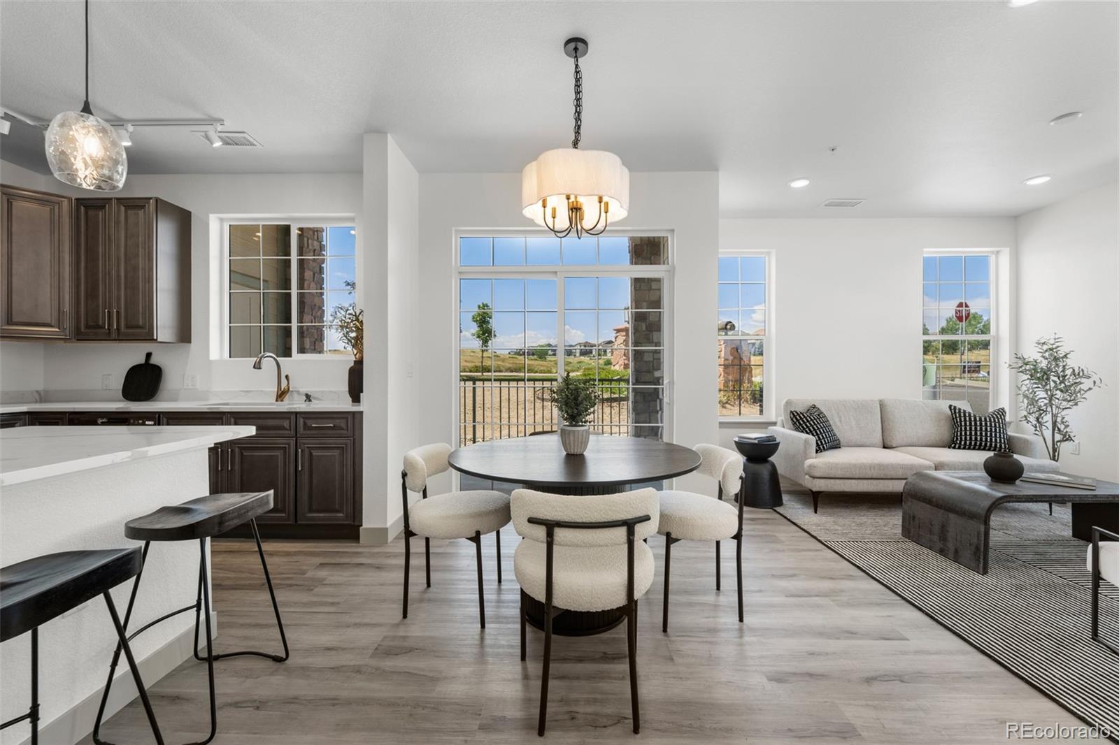 a view of a dining room with furniture window and wooden floor