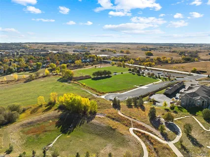 an aerial view of a houses with a lake view